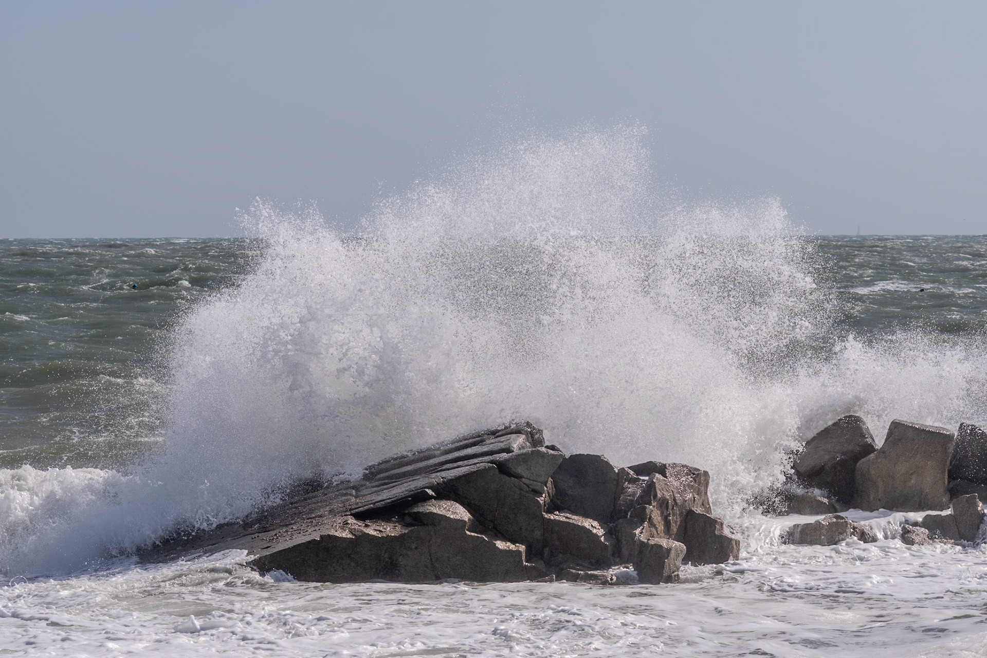 A study in contrast and chaos—where the relentless rhythm of the tide meets the immovable granite of the Dublin coast.