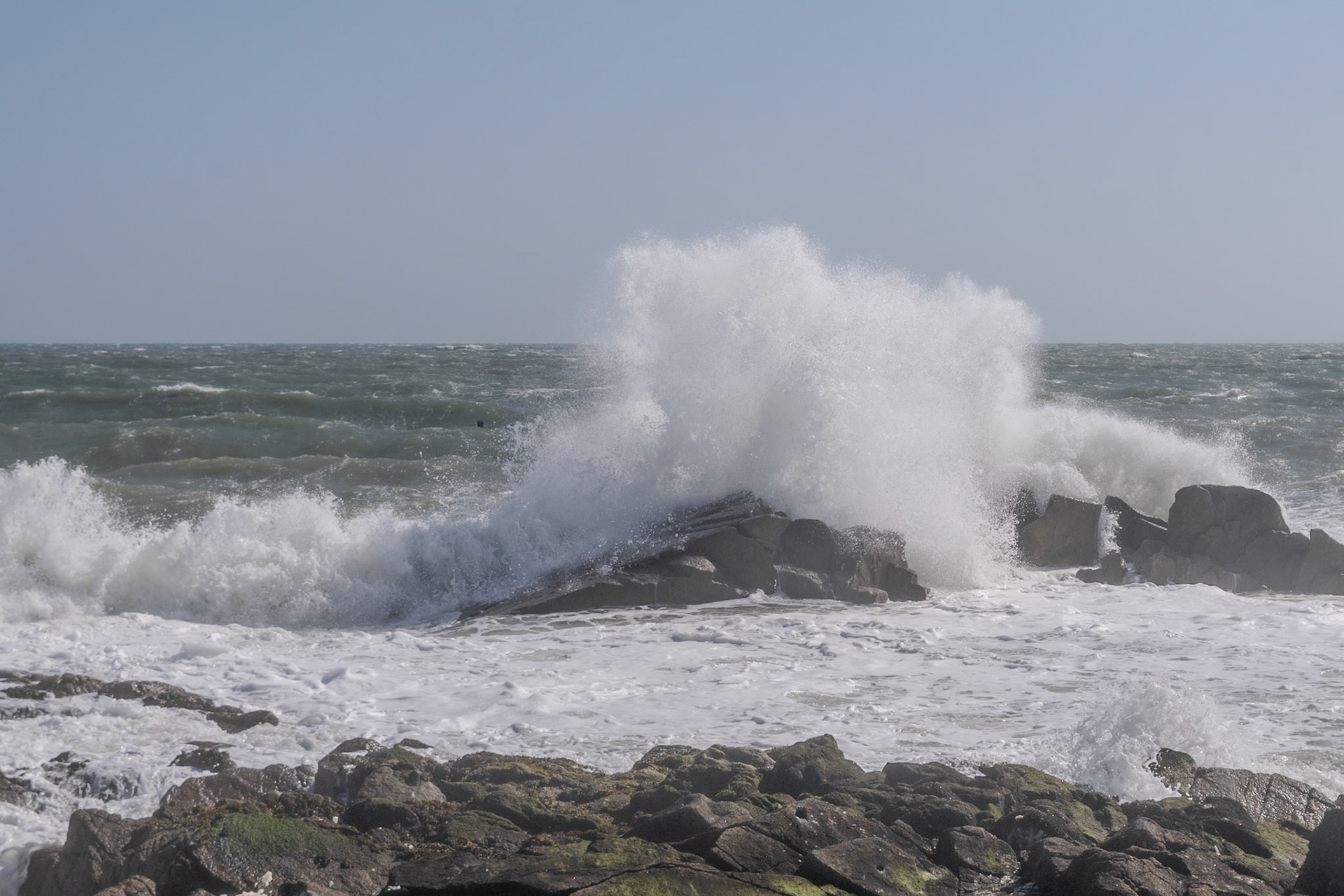 A study in contrast and chaos—where the relentless rhythm of the tide meets the immovable granite of the Dublin coast.