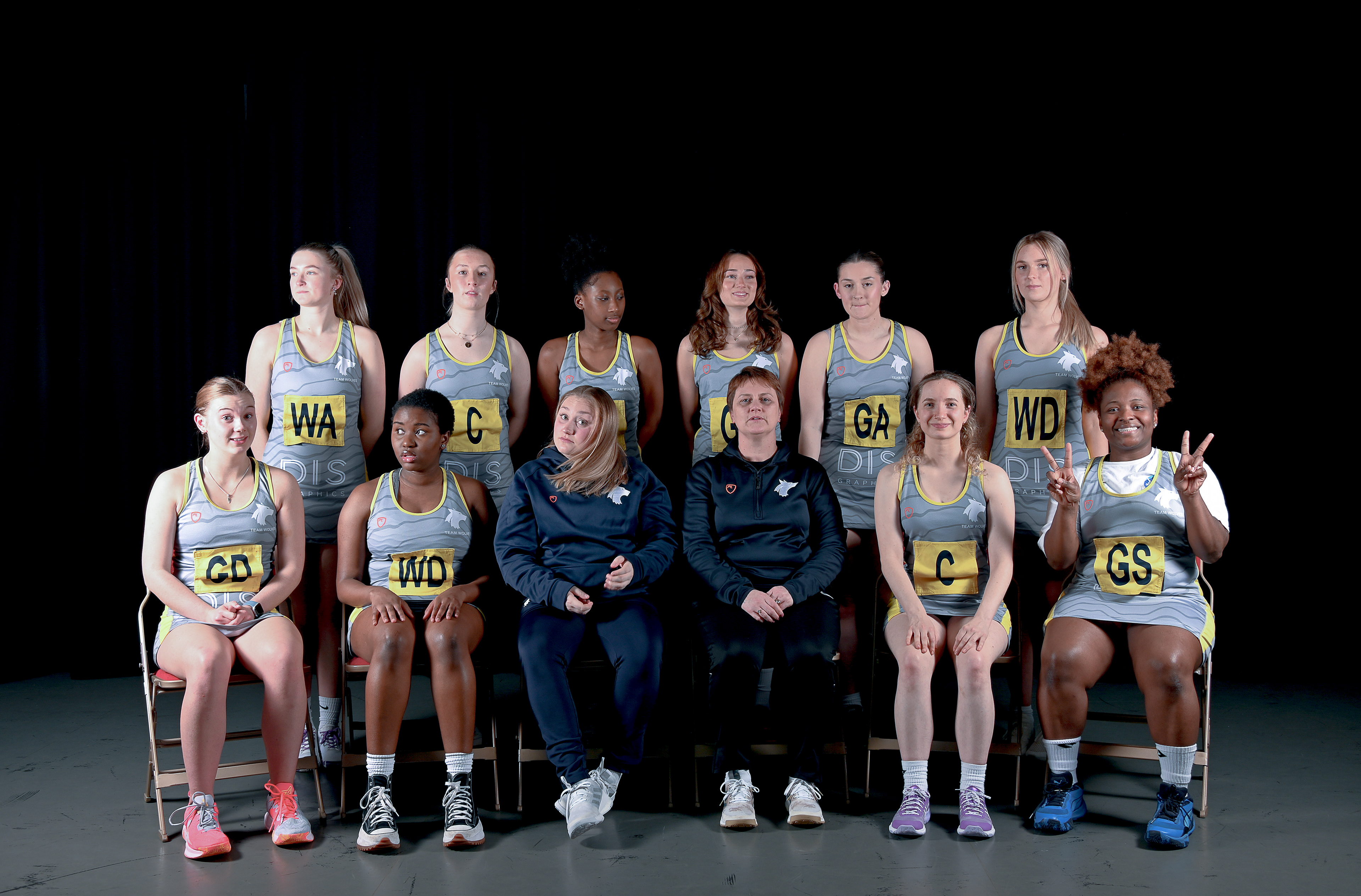 a group of young women wearing sports wear