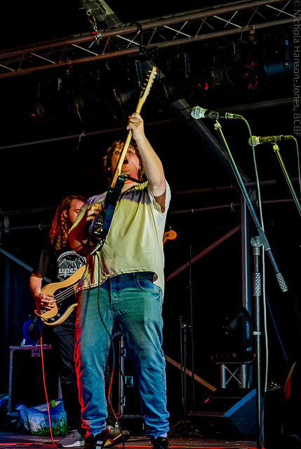 Black Country Boat Festival - Promo - Guitarist performing on stage, he is holding his guitar up