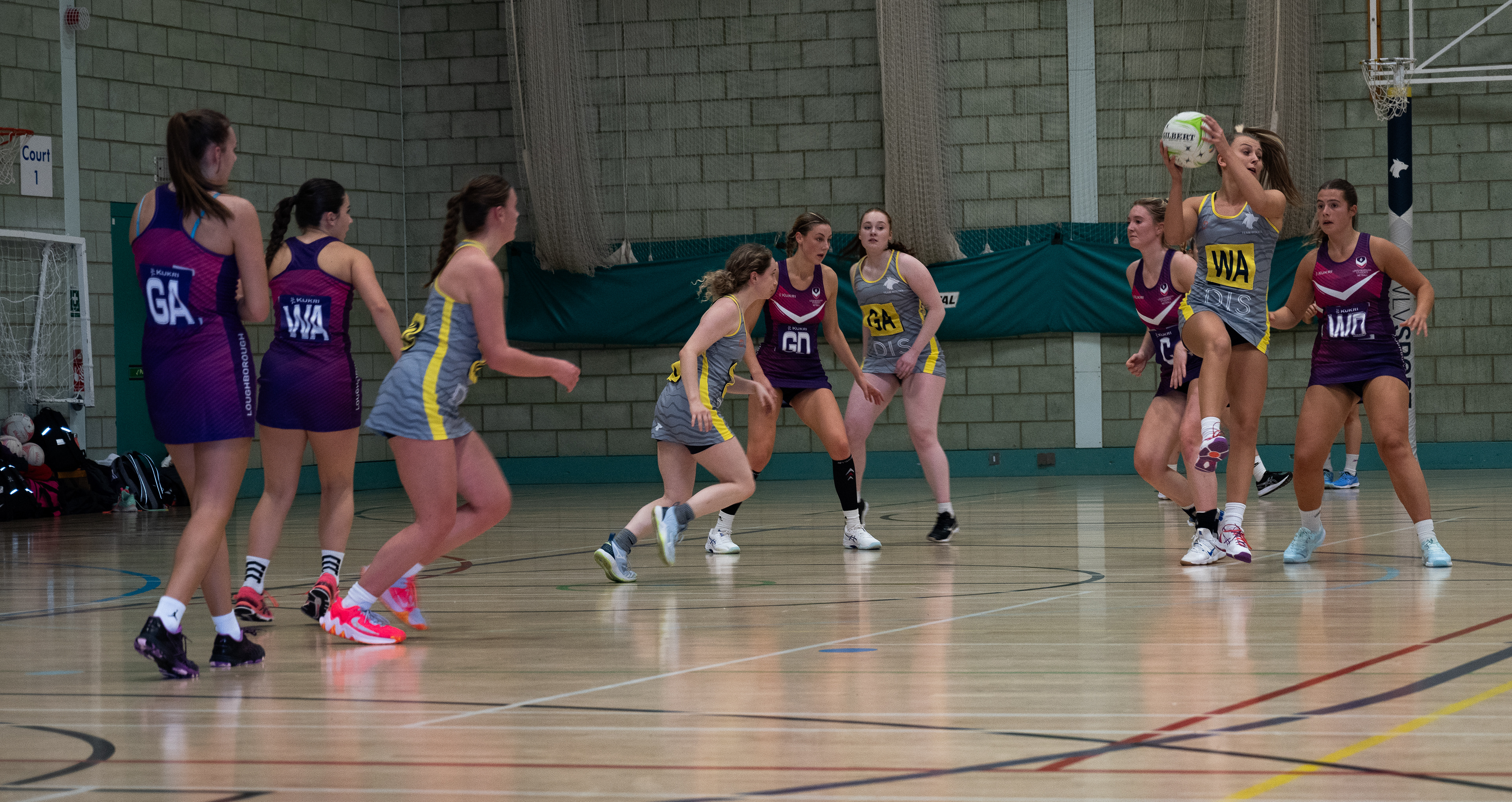 two teams of women playing netball