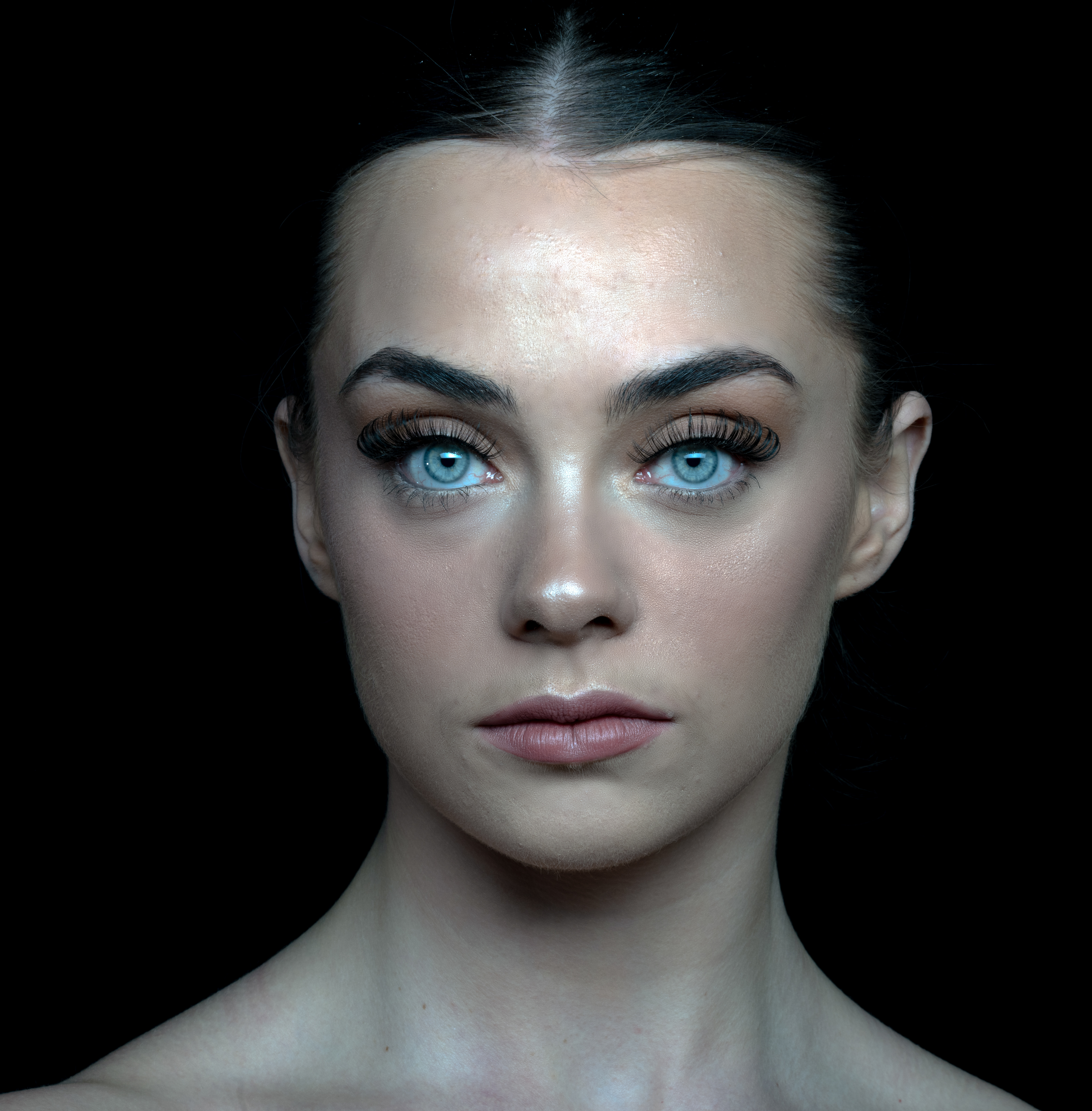 Courtney-Portfolio Shoot - A young woman with blue eyes looks directly at the camera