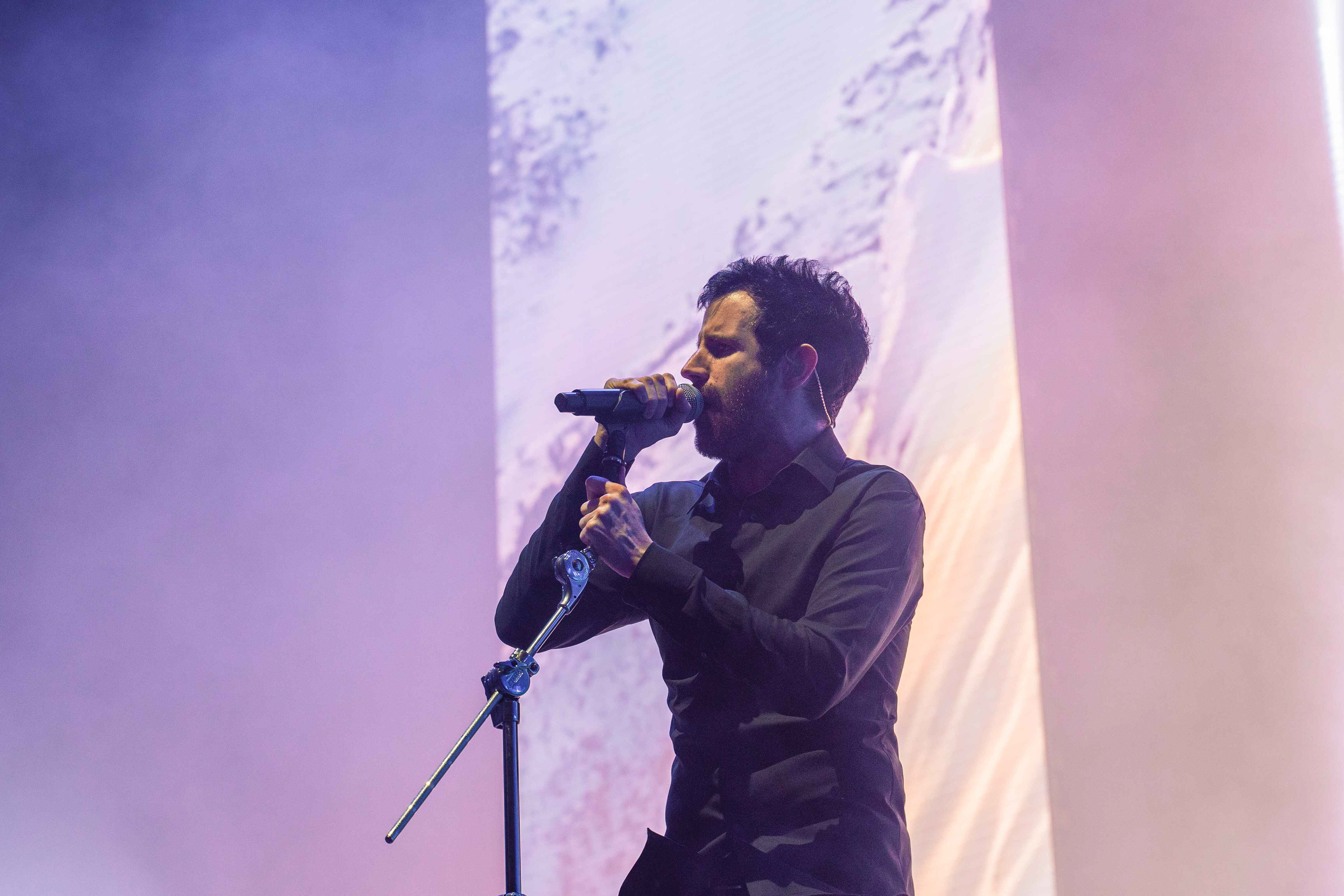 Close up shot of Rob Swire of Pendulum performing live on stage at First Direct Arena in Leeds on Sunday 24th March 2024
