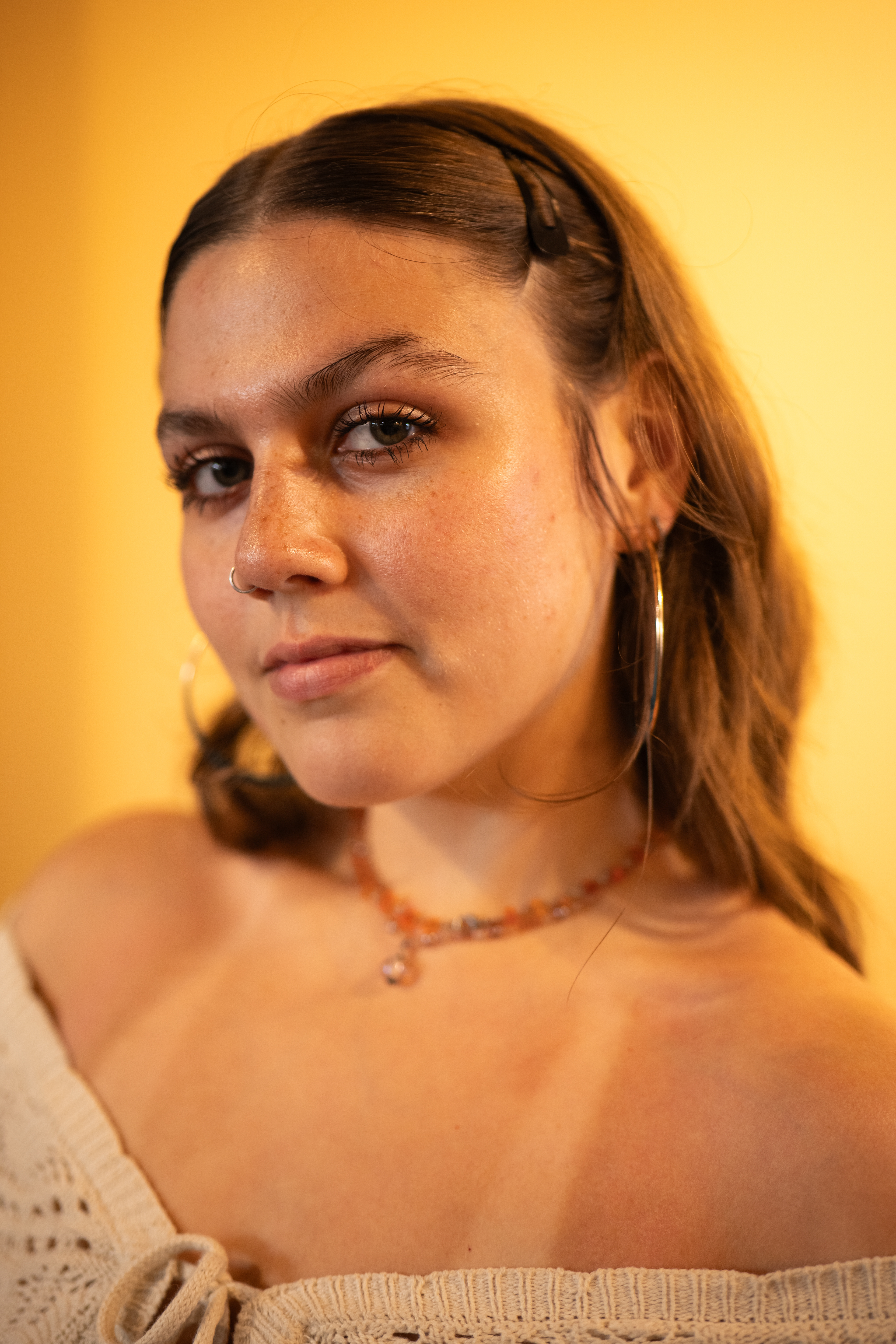 Needing an inviting photo quickly for their teacher profile,  Rebecca reached out to me to get something done on short notice and without any preparation. Manipulating existing lighting and utilizing pops of color in their place of work, I was able to get them a result that they loved!