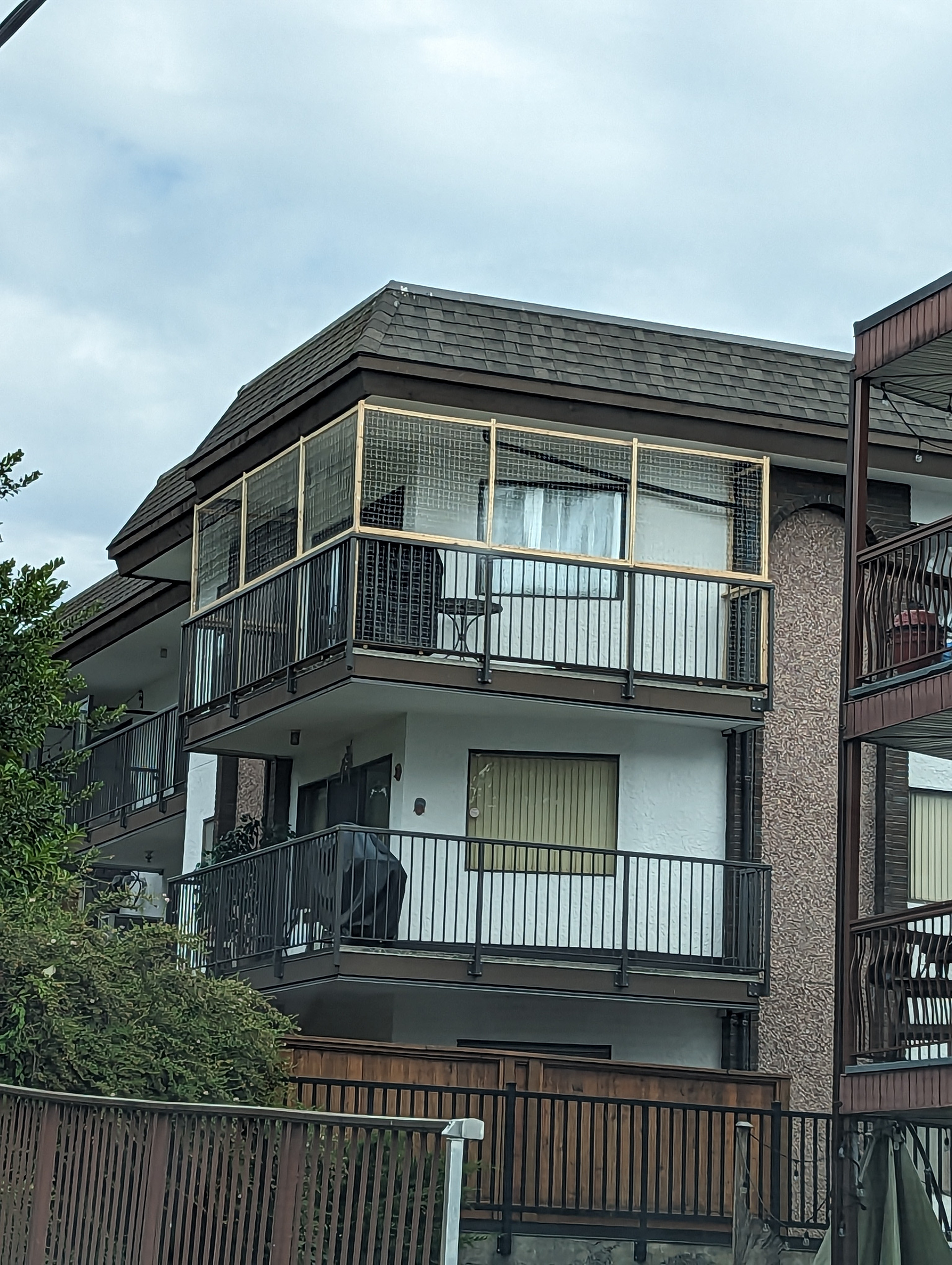 An apartment deck secured for safe cat access.