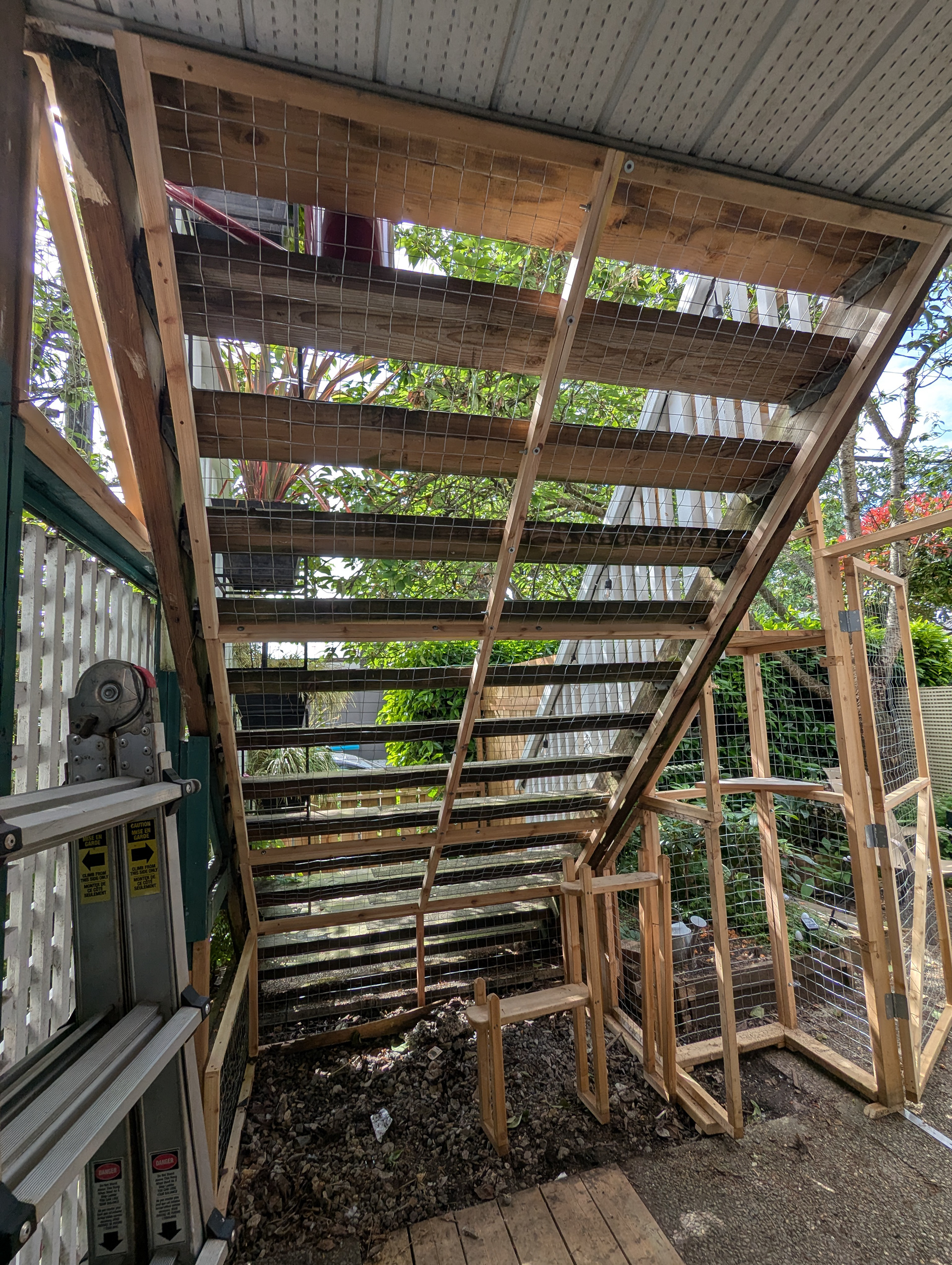 This catio occupies quite a large space under some stairs.