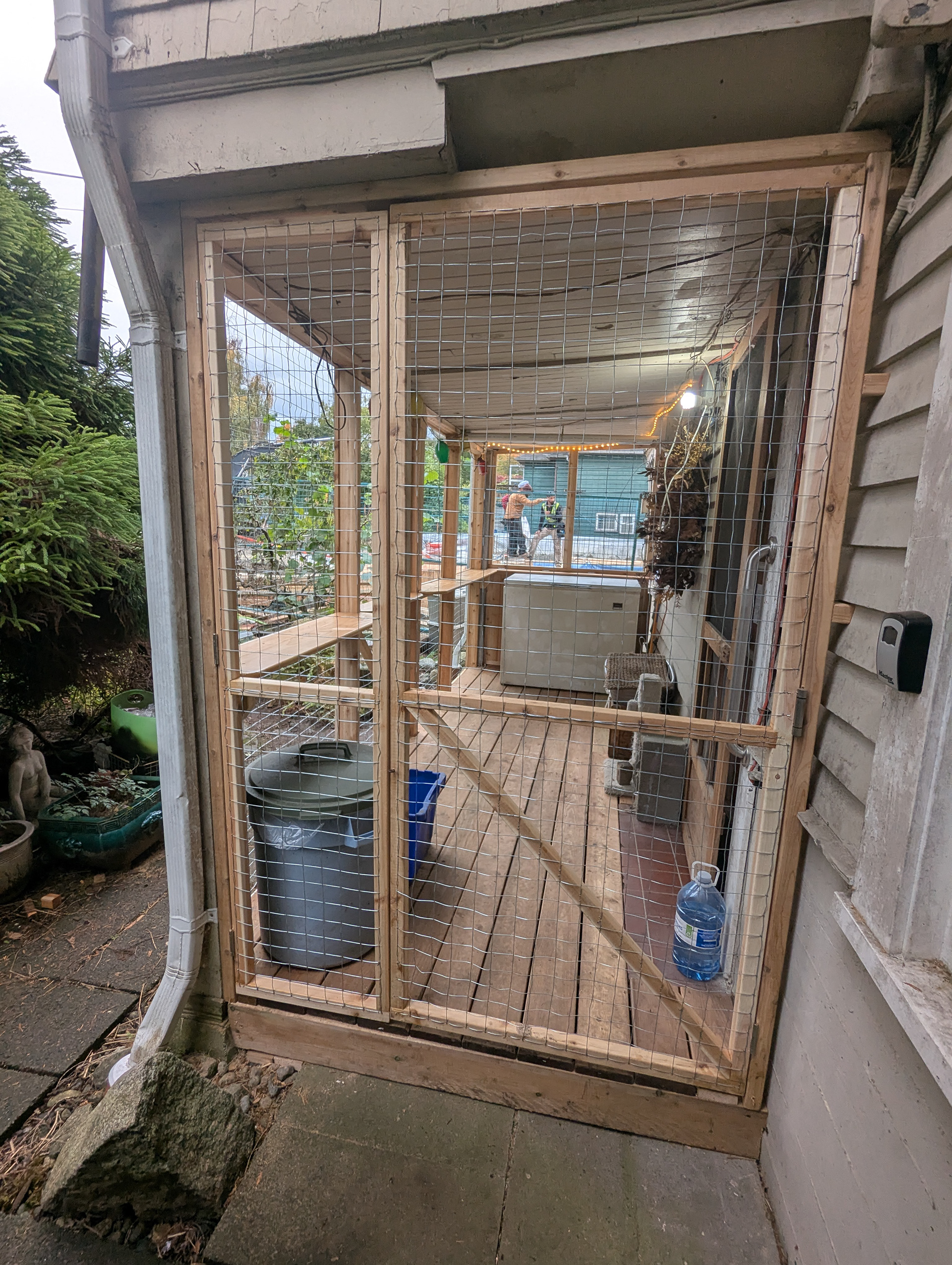 These doors can both open; one for everyday use, with a smaller one anchored top and bottom.