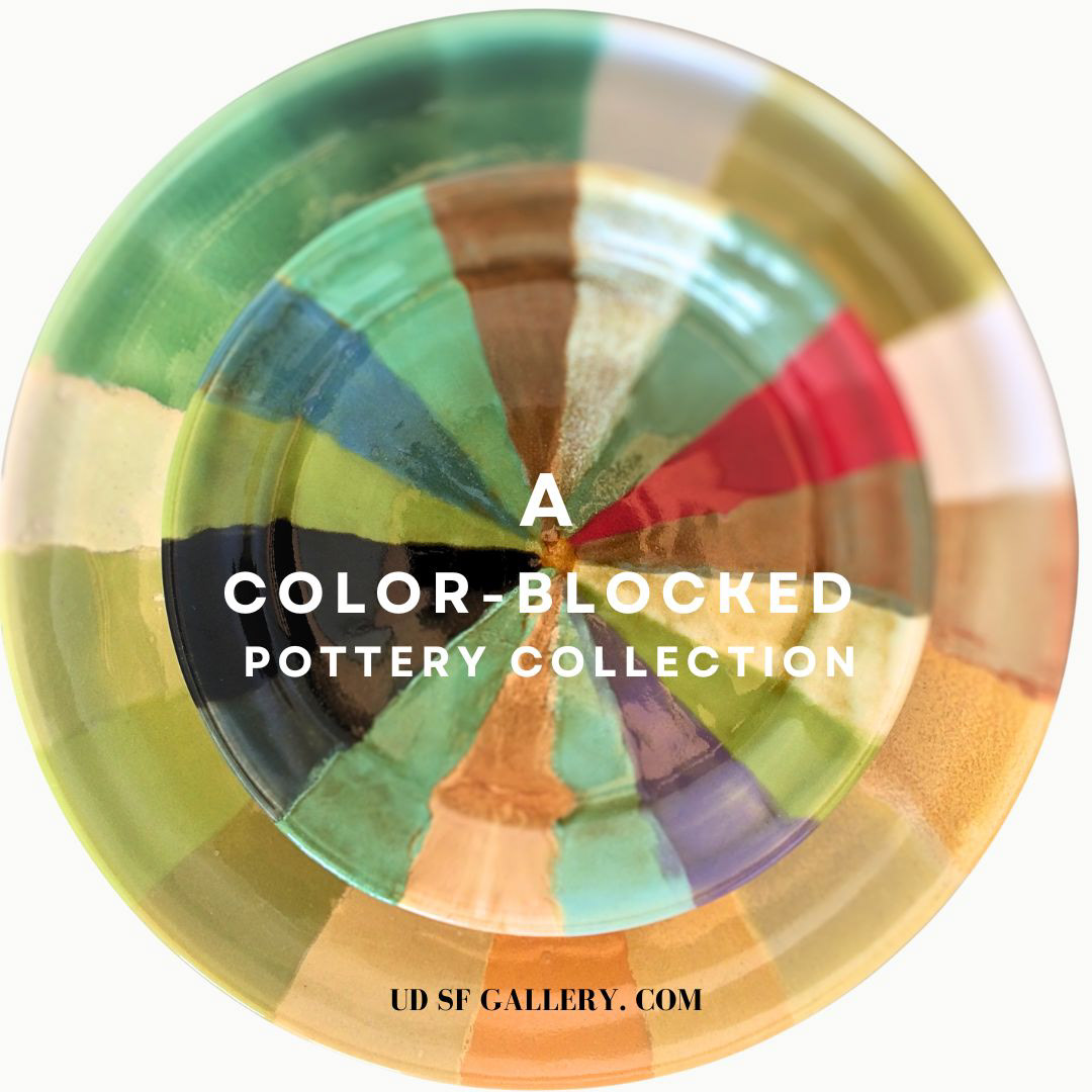 Bird's eye view of a color-blocked pottery set featuring a small and big plate. The vibrant color blocks transition from shades of orange to purple, creating a visually striking arrangement.