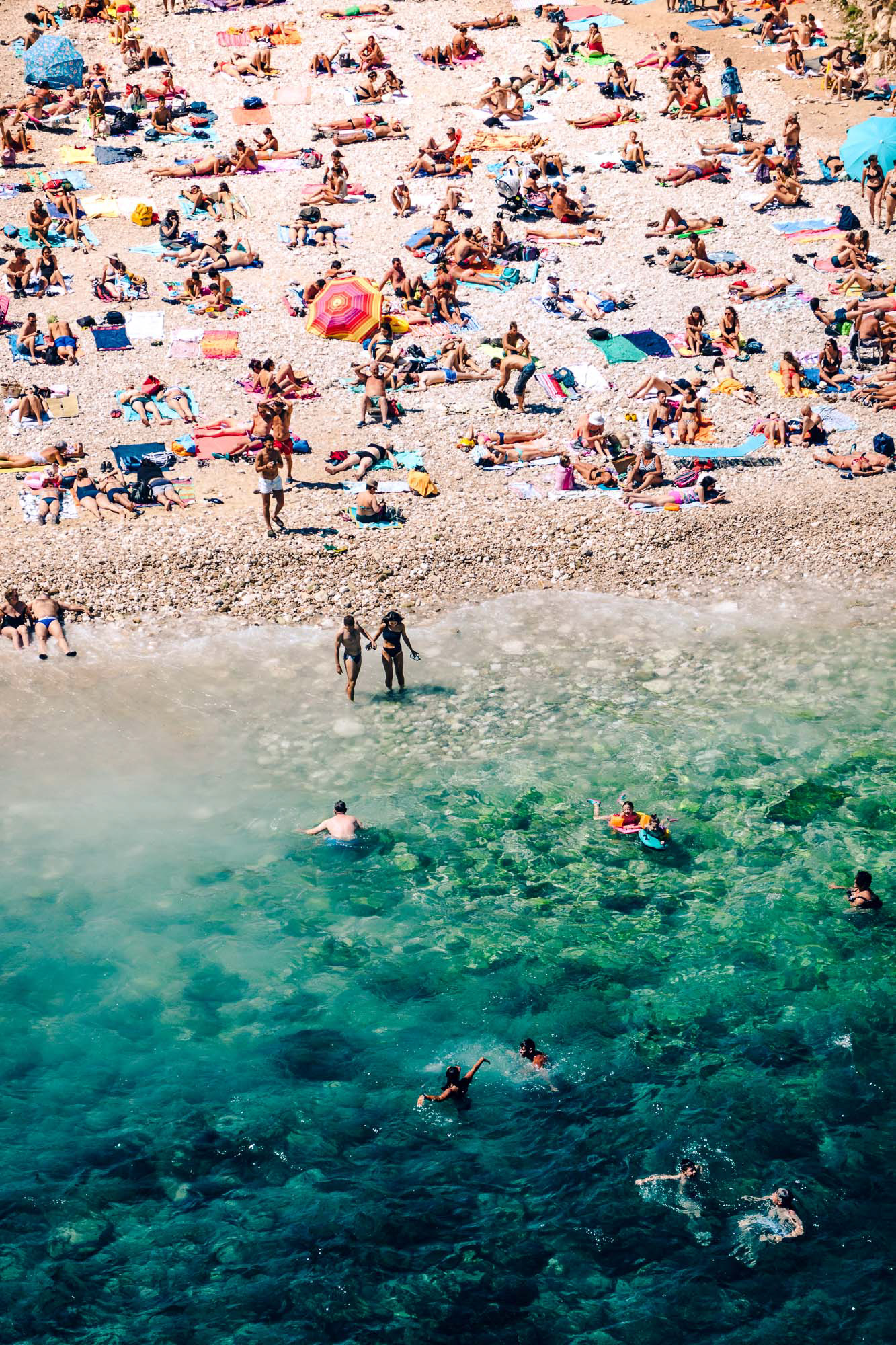 Travel photography showing the beach at Polignano a Mare from above