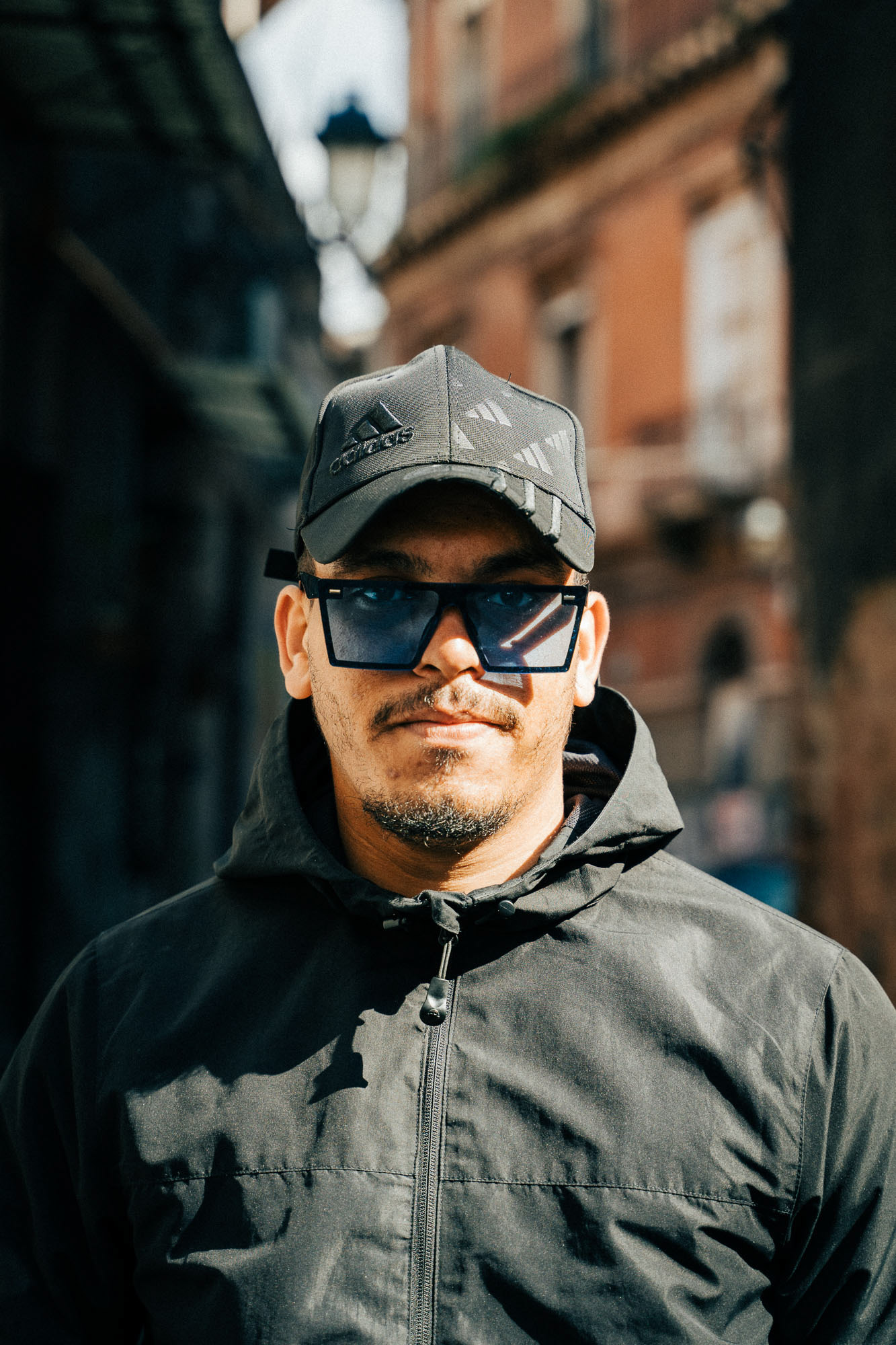 Street portrait of a young man in Catania
