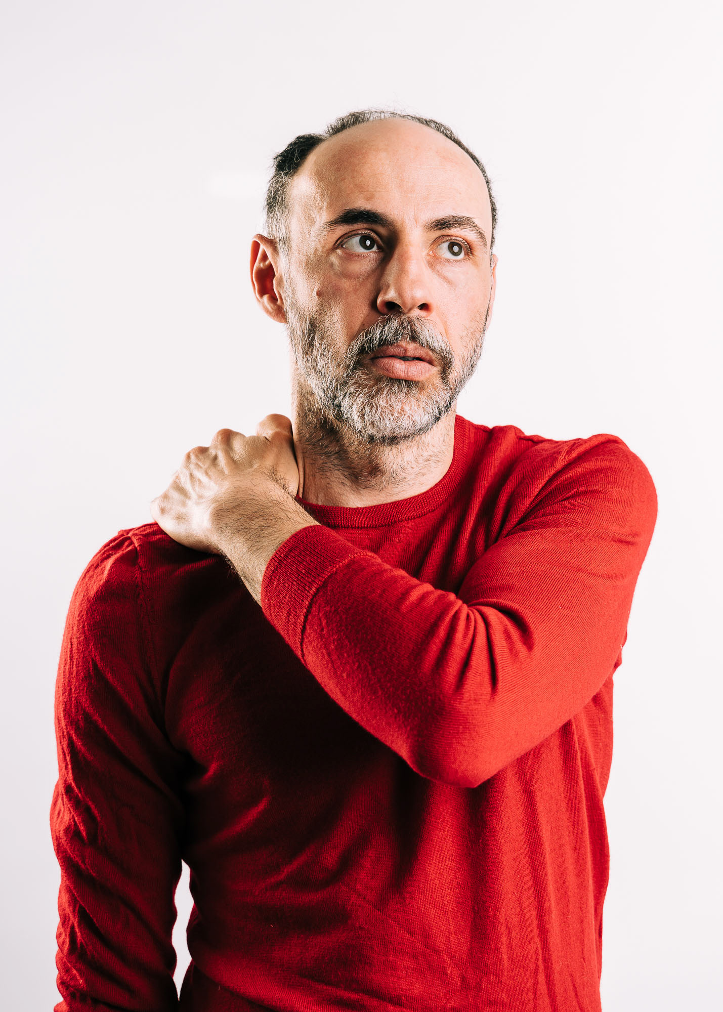 Studio portrait of actor Florian Tröbinger against a white background
