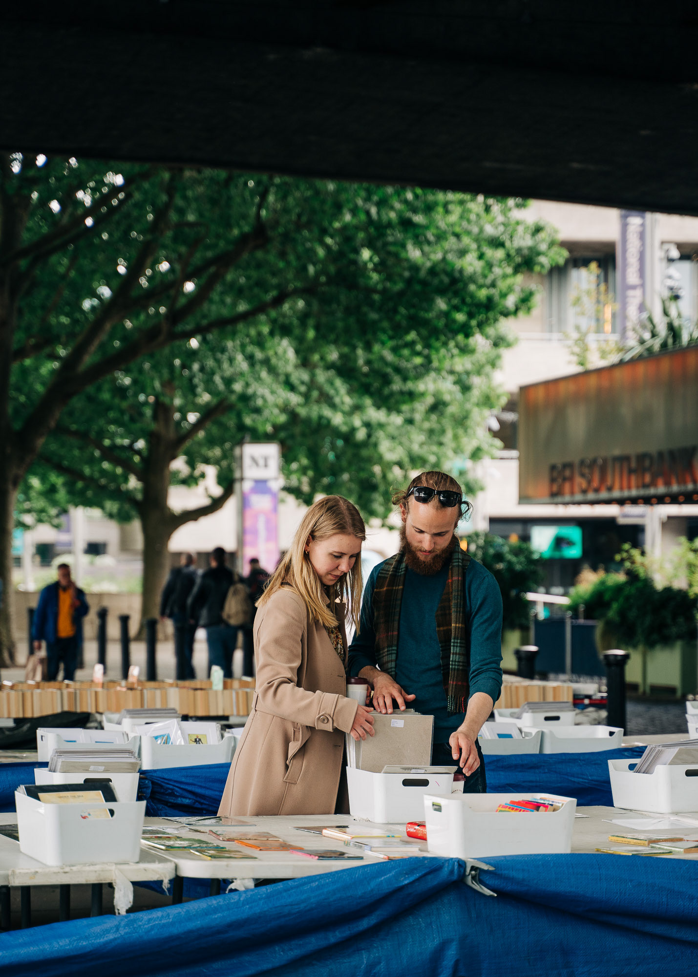 A young couple photoraphed while browsing through a fleamarket in front of the BFI Southbank