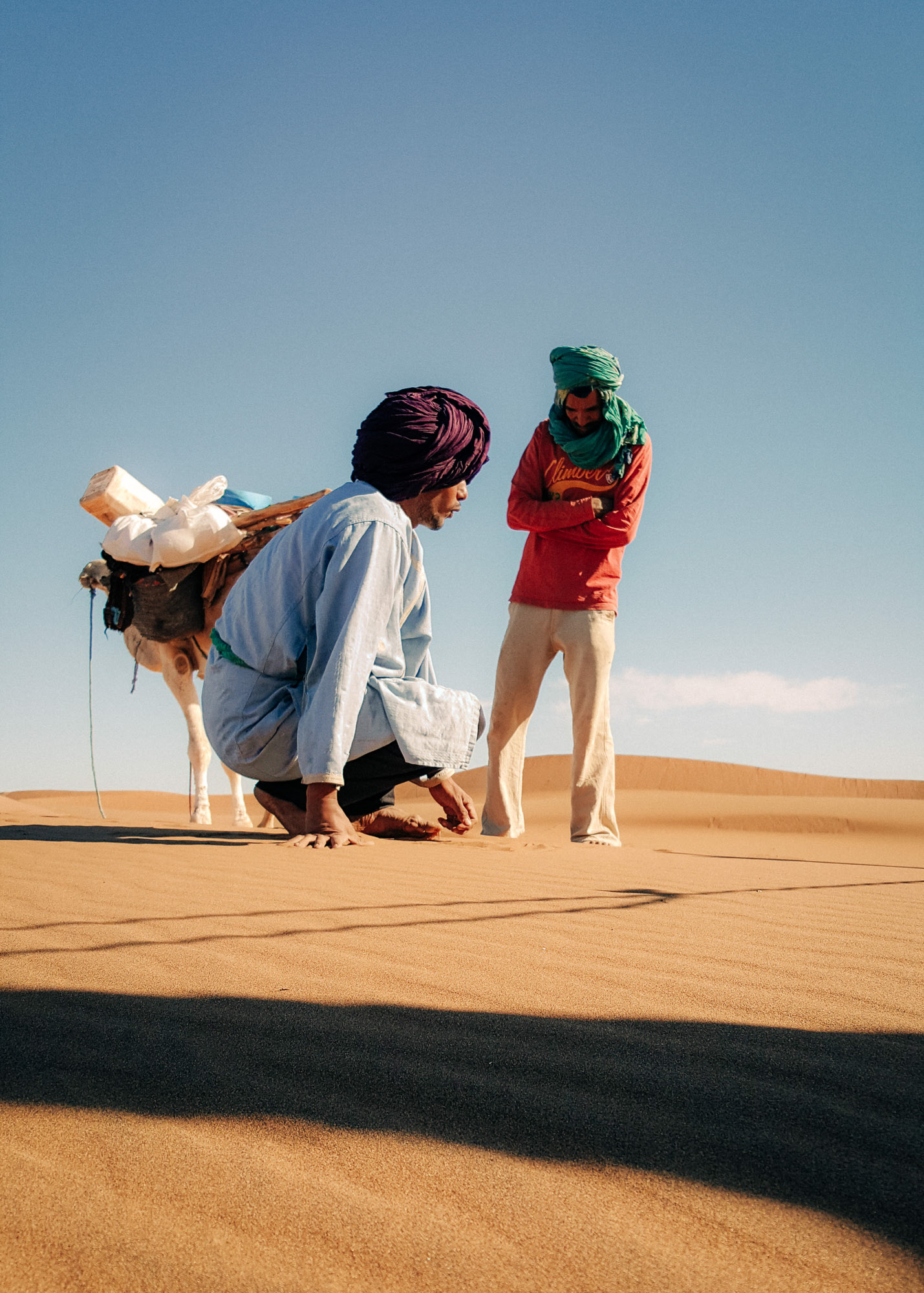 Two Berber men wearing turbans photographed in the Sahara desert