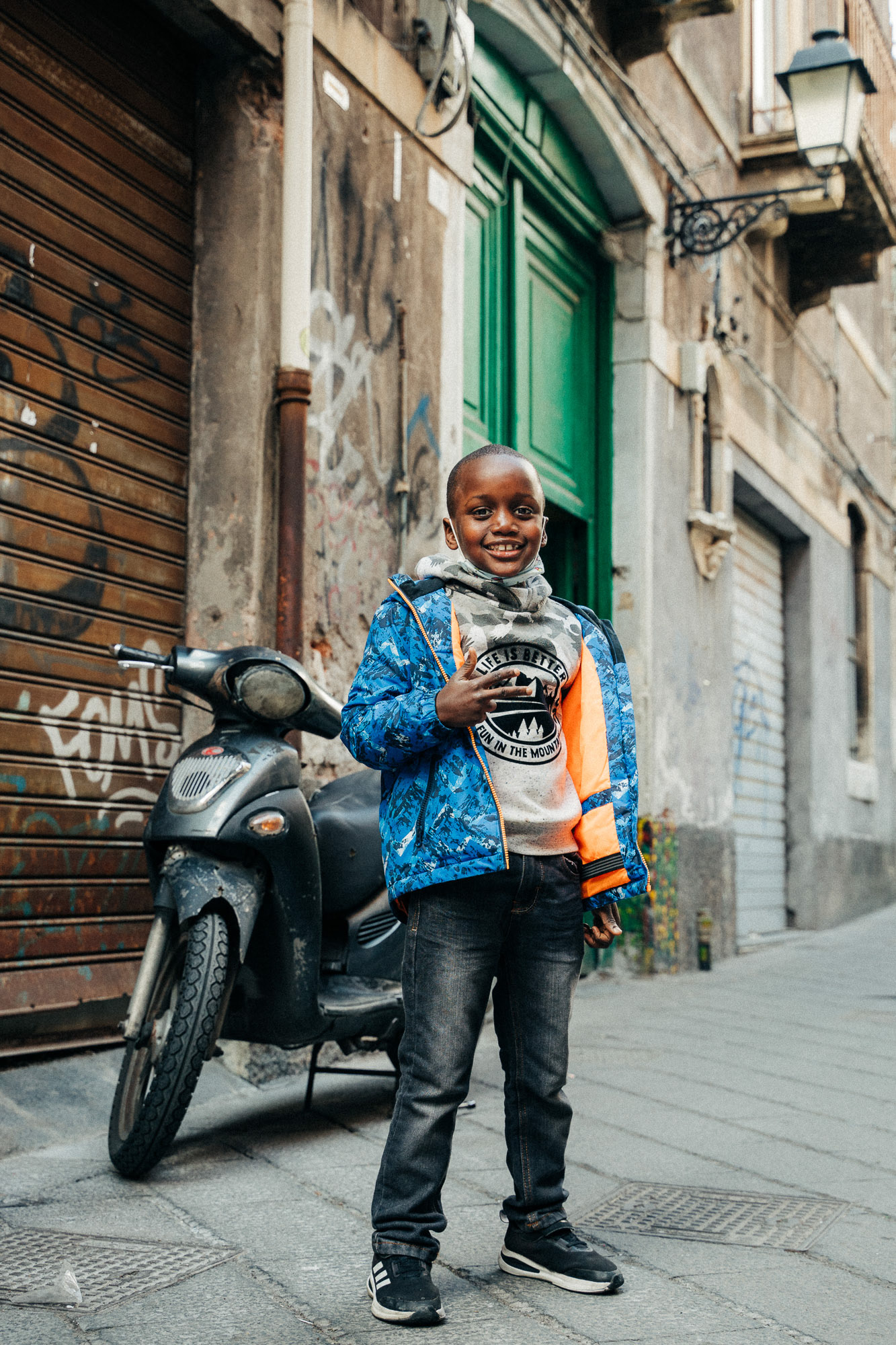 Portrait of a little boy in the streets of Catania