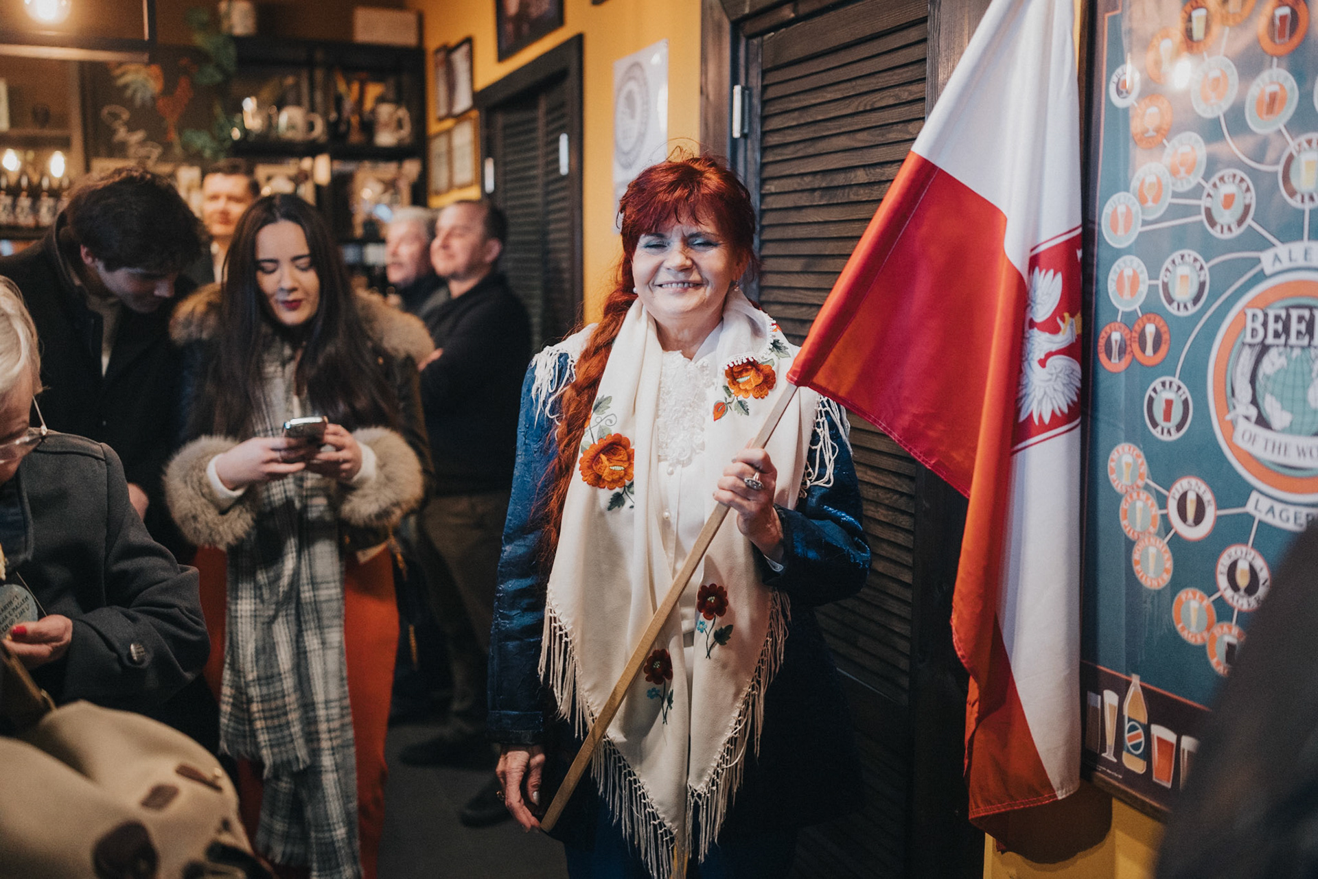 A woman in a traditional Lowicz folk costume waits to meet Karol Nawrocki, an independent candidate supported by PiS.