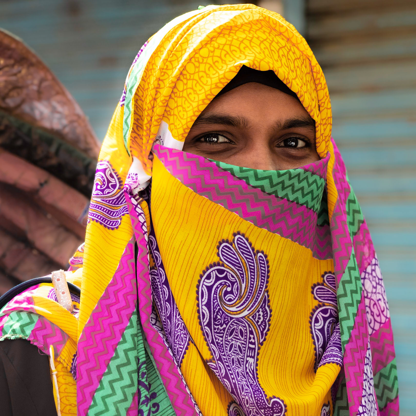Woman in Dhaka wearing a colorful niqab