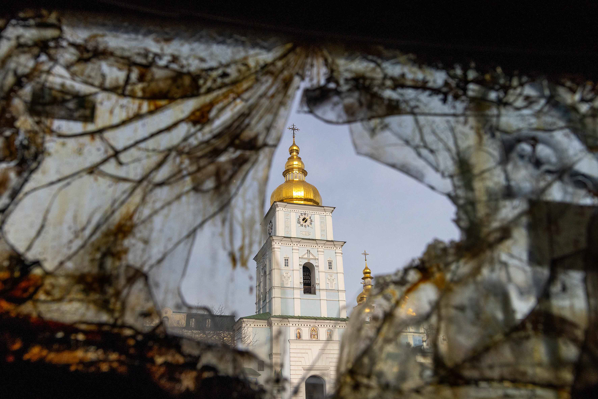 View of a church dome from a destroyed military vehicle. © Marek Ladzinski / Zuma Press