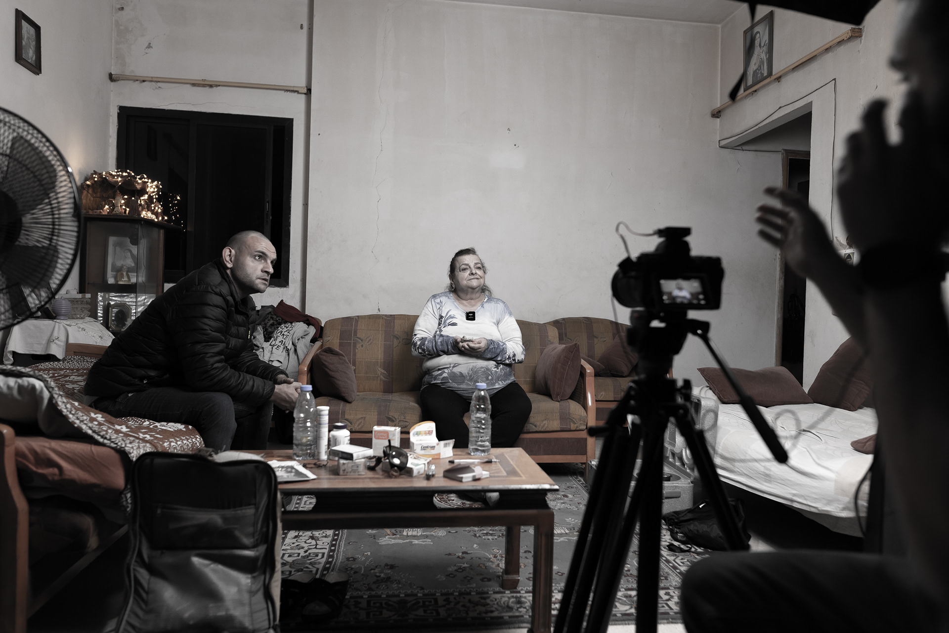 Fatima holds a small figurine of Christ, symbolizing hope and spiritual support. Photo © Marek Ladzinski.
