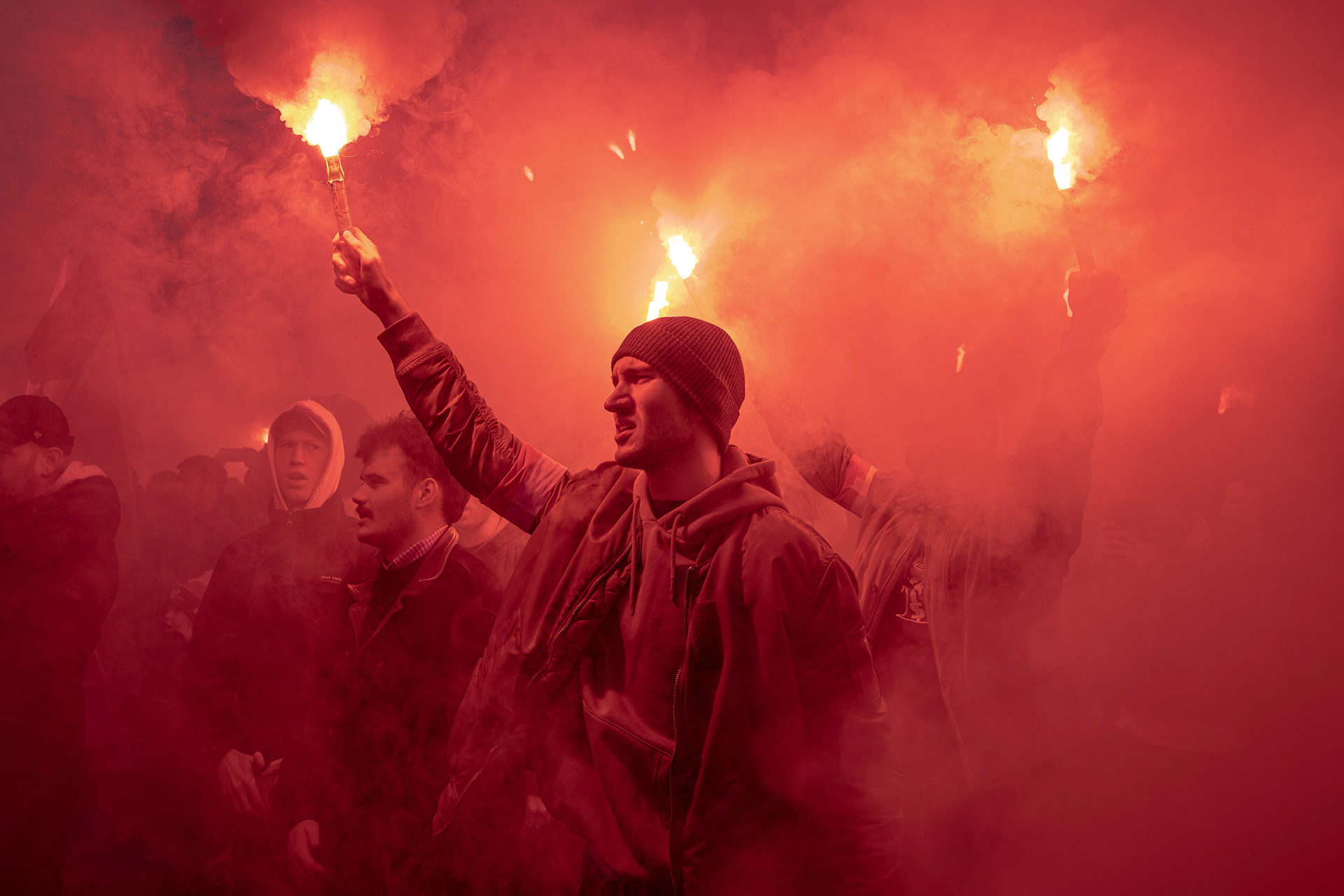 People light flares during the “W Hour” anniversary commemorations in Warsaw. Photo © Marek Ladzinski