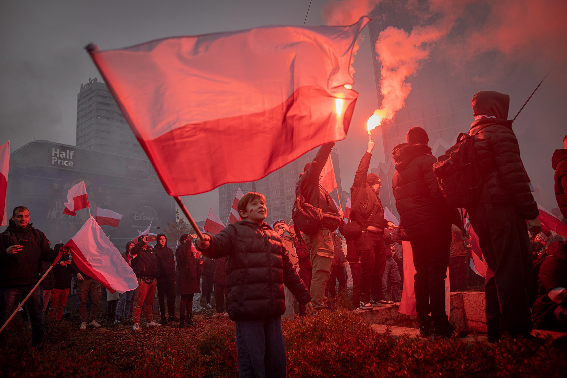 A young boy waves a Polish flag during Independence Day celebrations in Warsaw. Photo © Marek Ladzinski