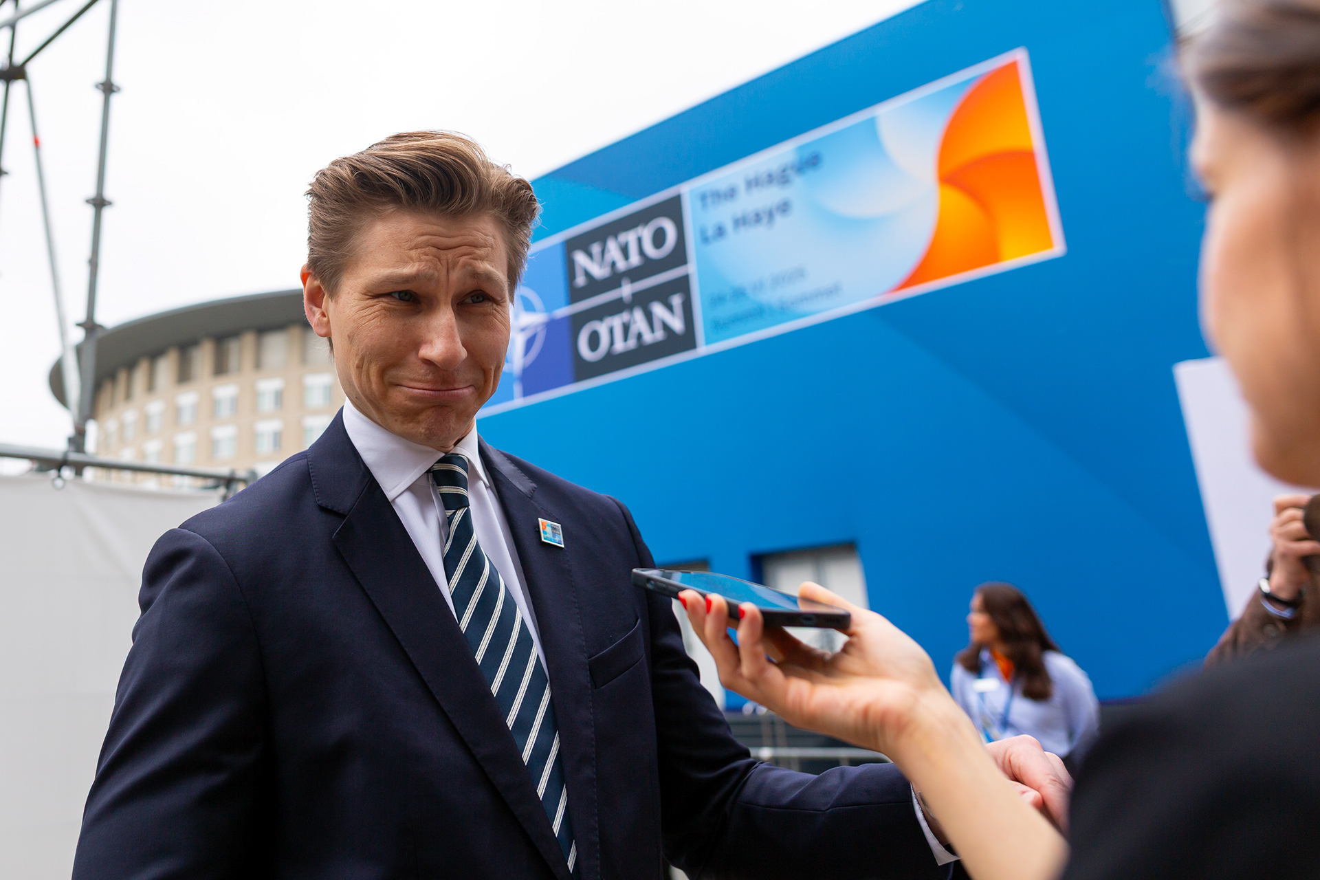 Finnish Minister of Defense Antti Häkkänen gives an interview on the first day of the 2025 NATO summit. Photo © Marek Ladzinski / FORUM
