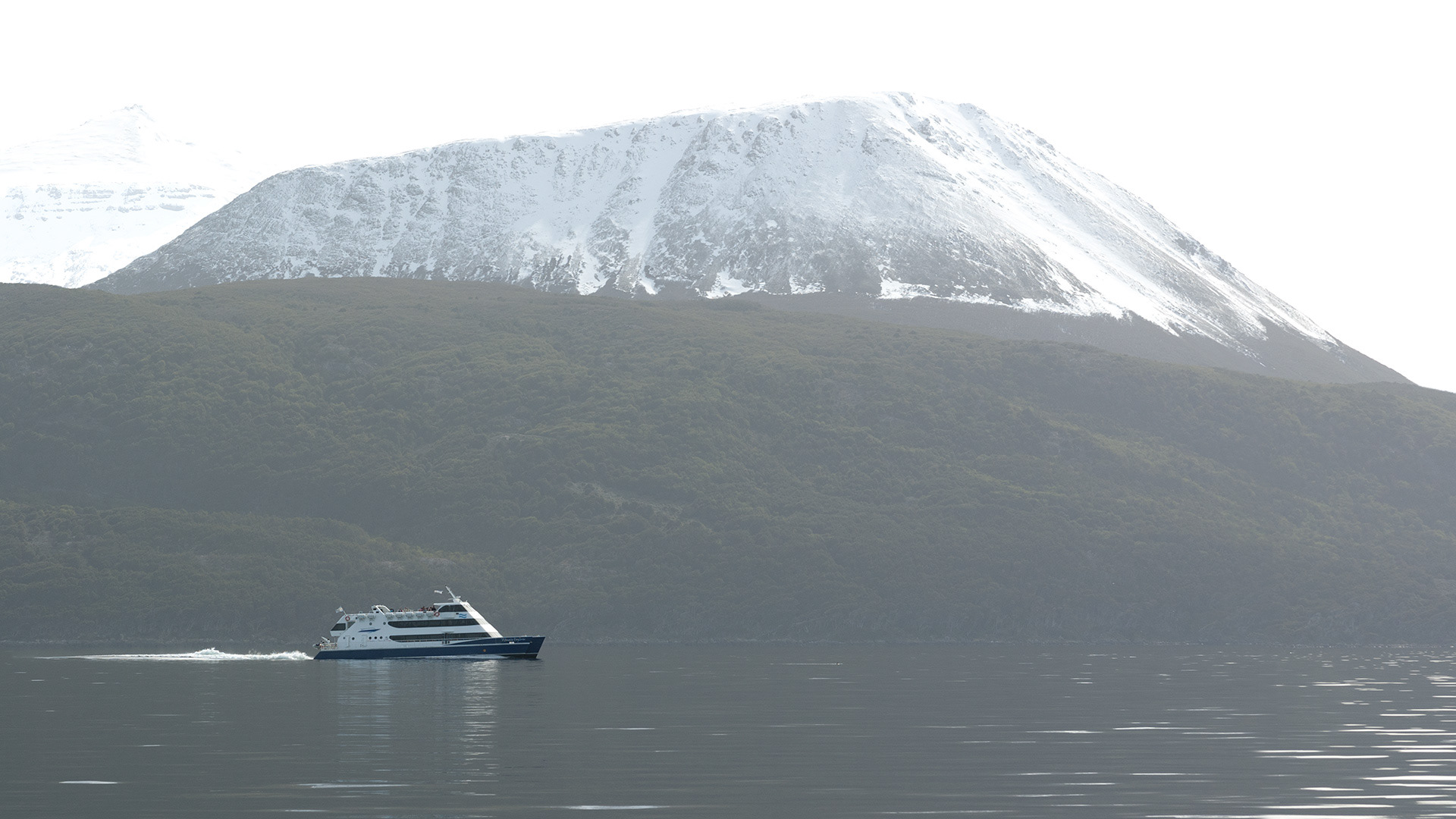 Launch and Mountain. Beagle Channel, Argentina.