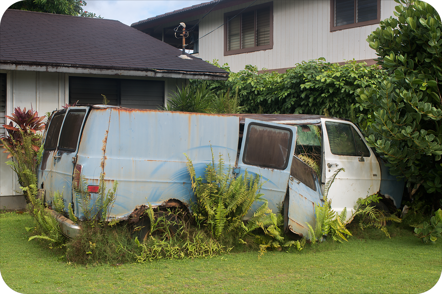 Junk car in the frontyard