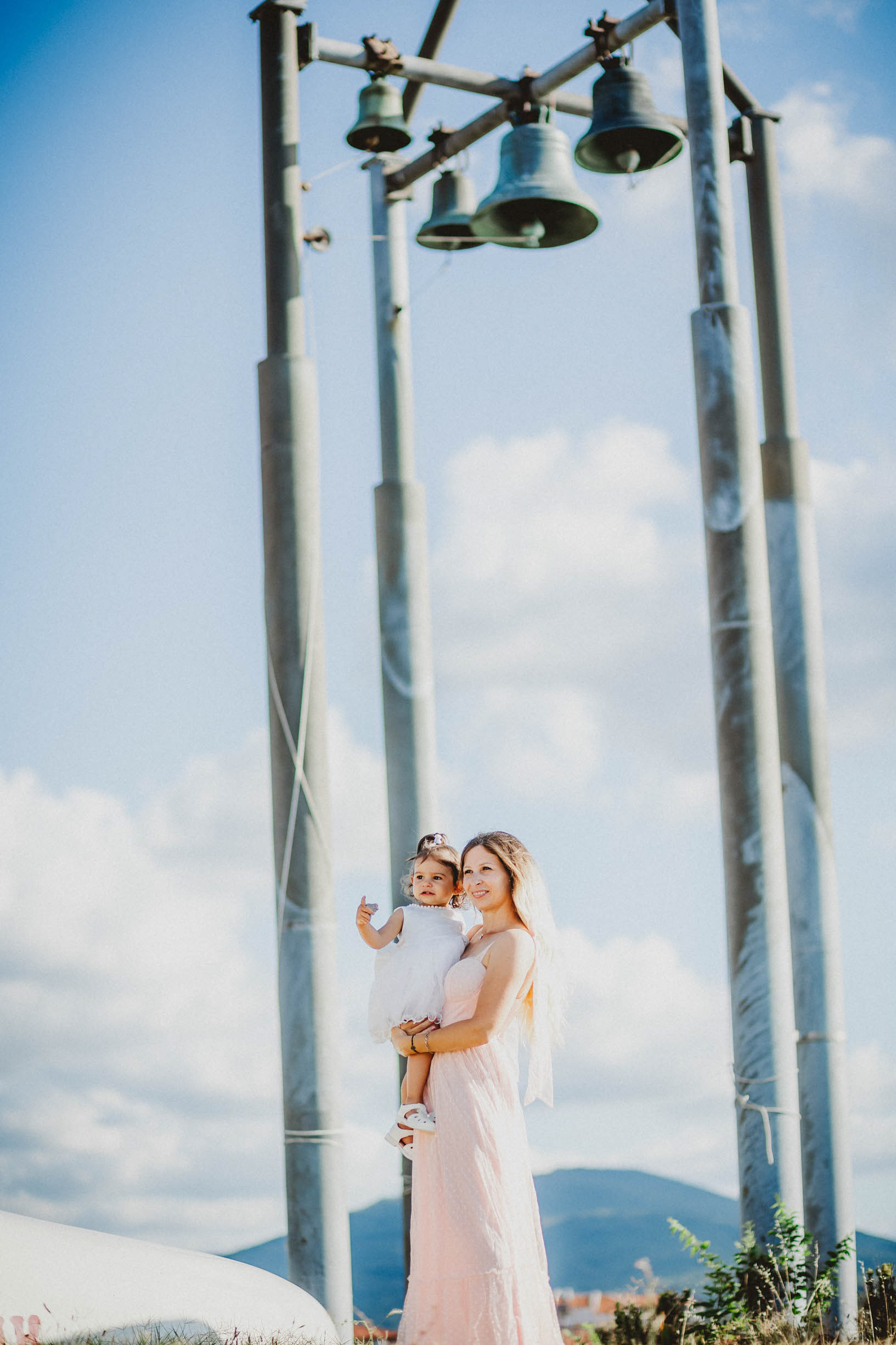 Свето кръщение в Царево, фотография пред камбаните на храм Св. Успение Богородично във Василико