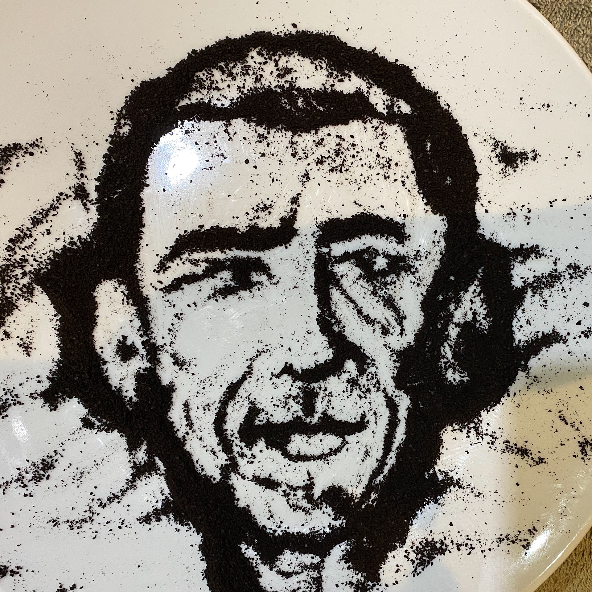 coffee grounds Obama on a plate