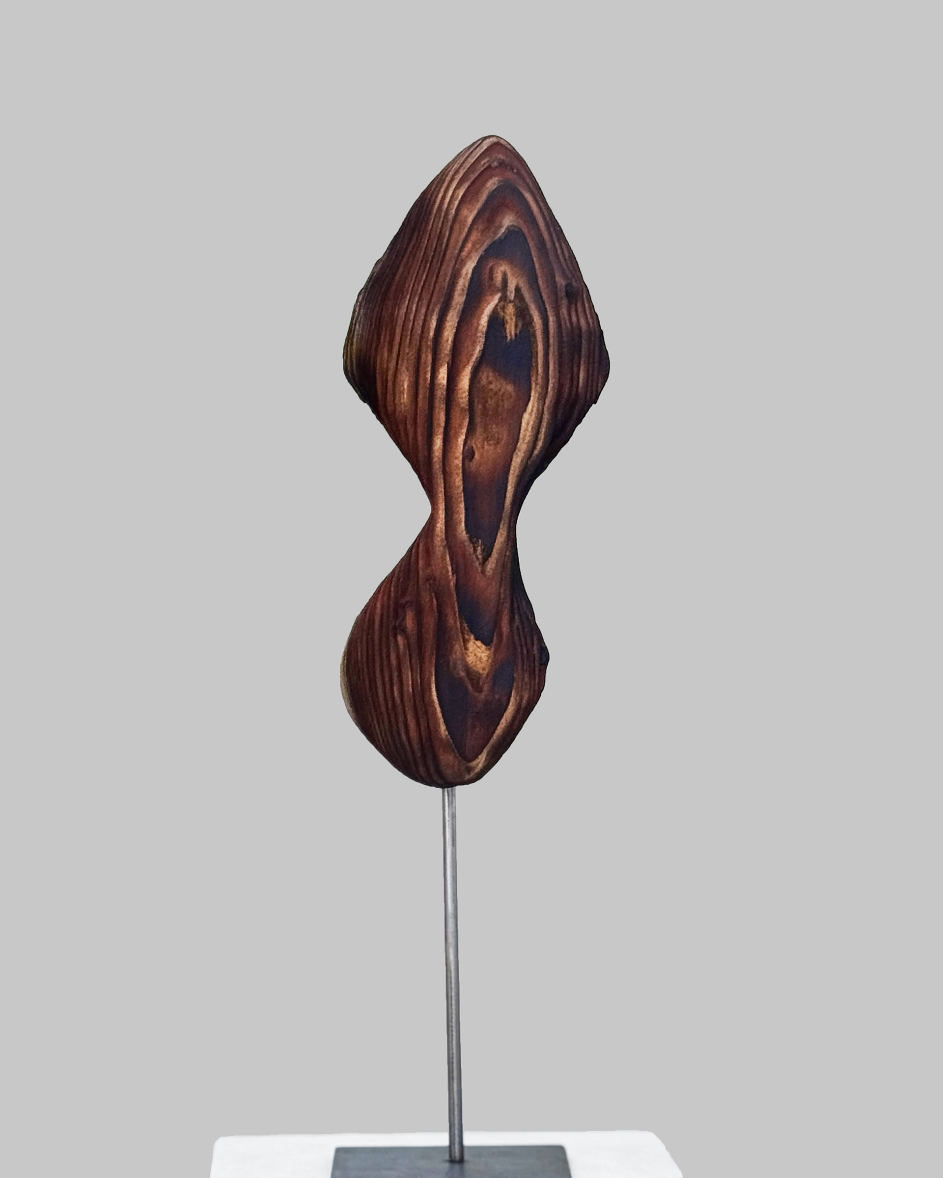 Wind Axis Strata, 2026. Charred, laminated California redwood sculpture by Kendall Conrad, 12 × 5 × 2 in.