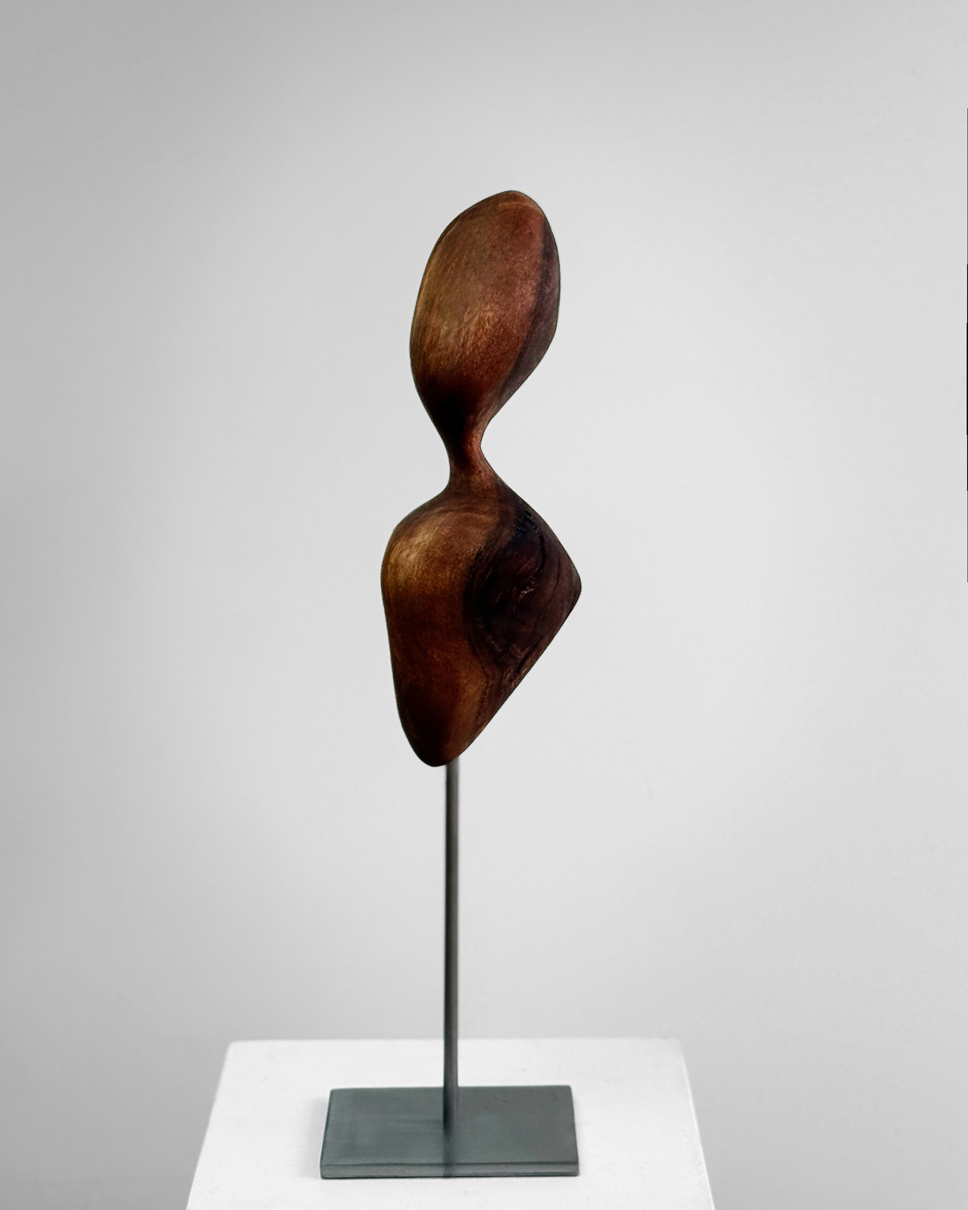 Stem Axis, 2026. California black walnut sculpture by Kendall Conrad, 10 × 4 × 4 in.