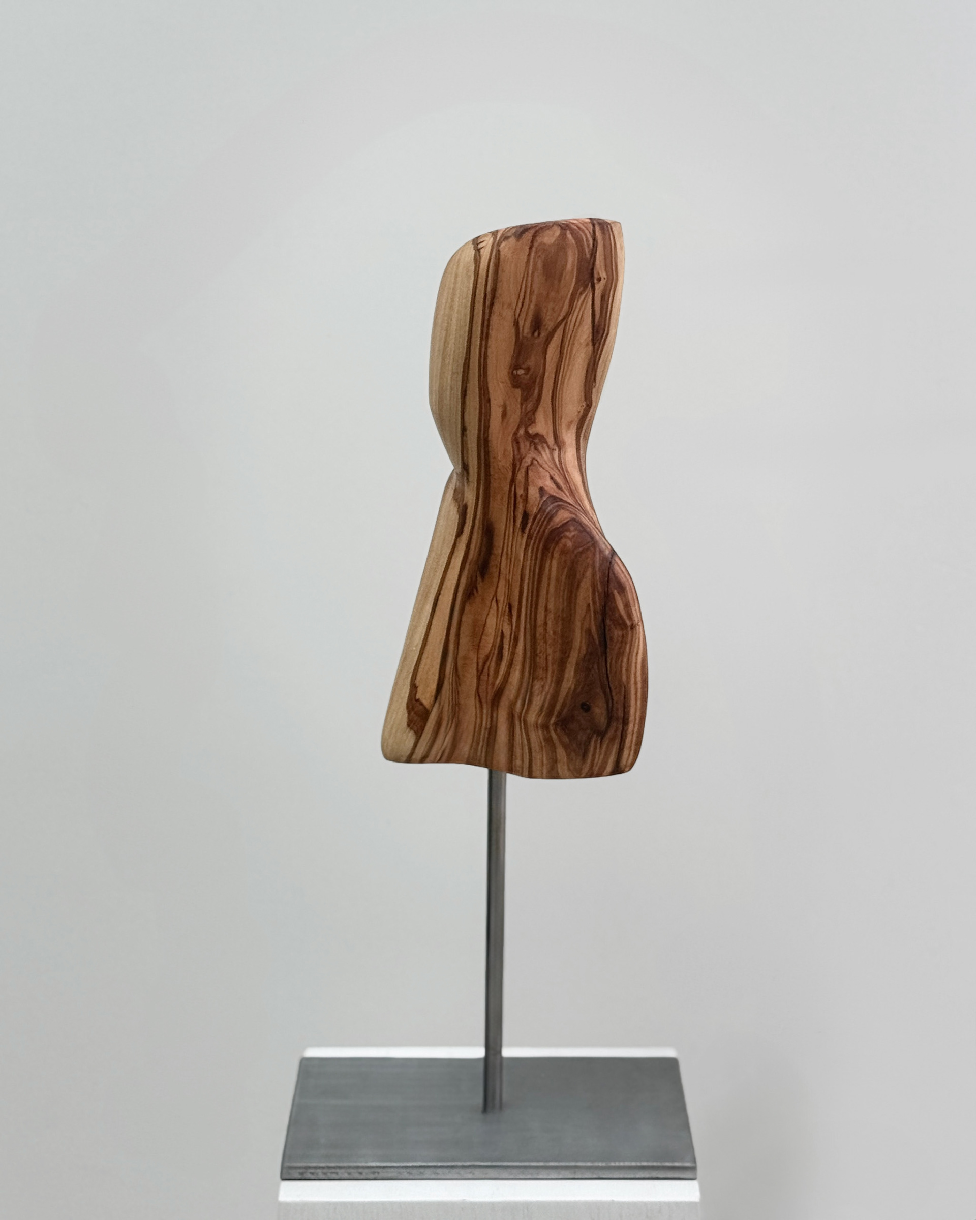 Stratum, 2025. Olive wood sculpture by Kendall Conrad, 11 × 6 × 4 in.
