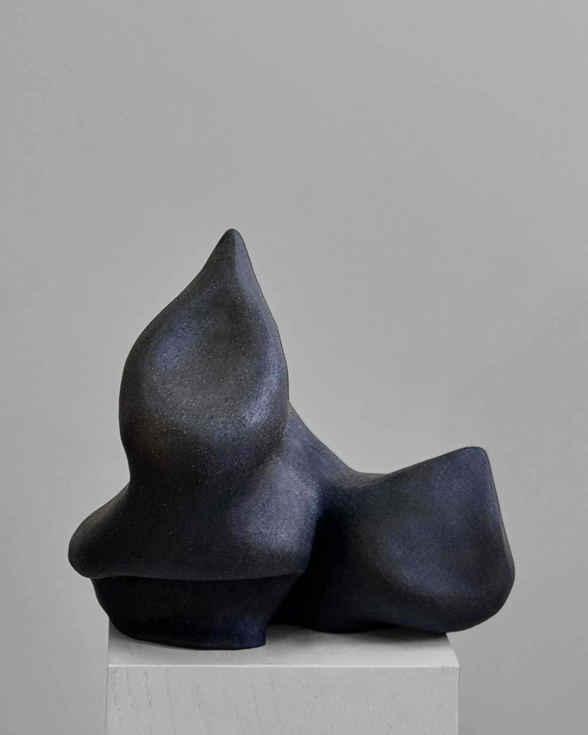 Lava Spur, 2025. Black stoneware with hematite crawl glaze sculpture by Kendall Conrad, 9 × 15 × 15 in.