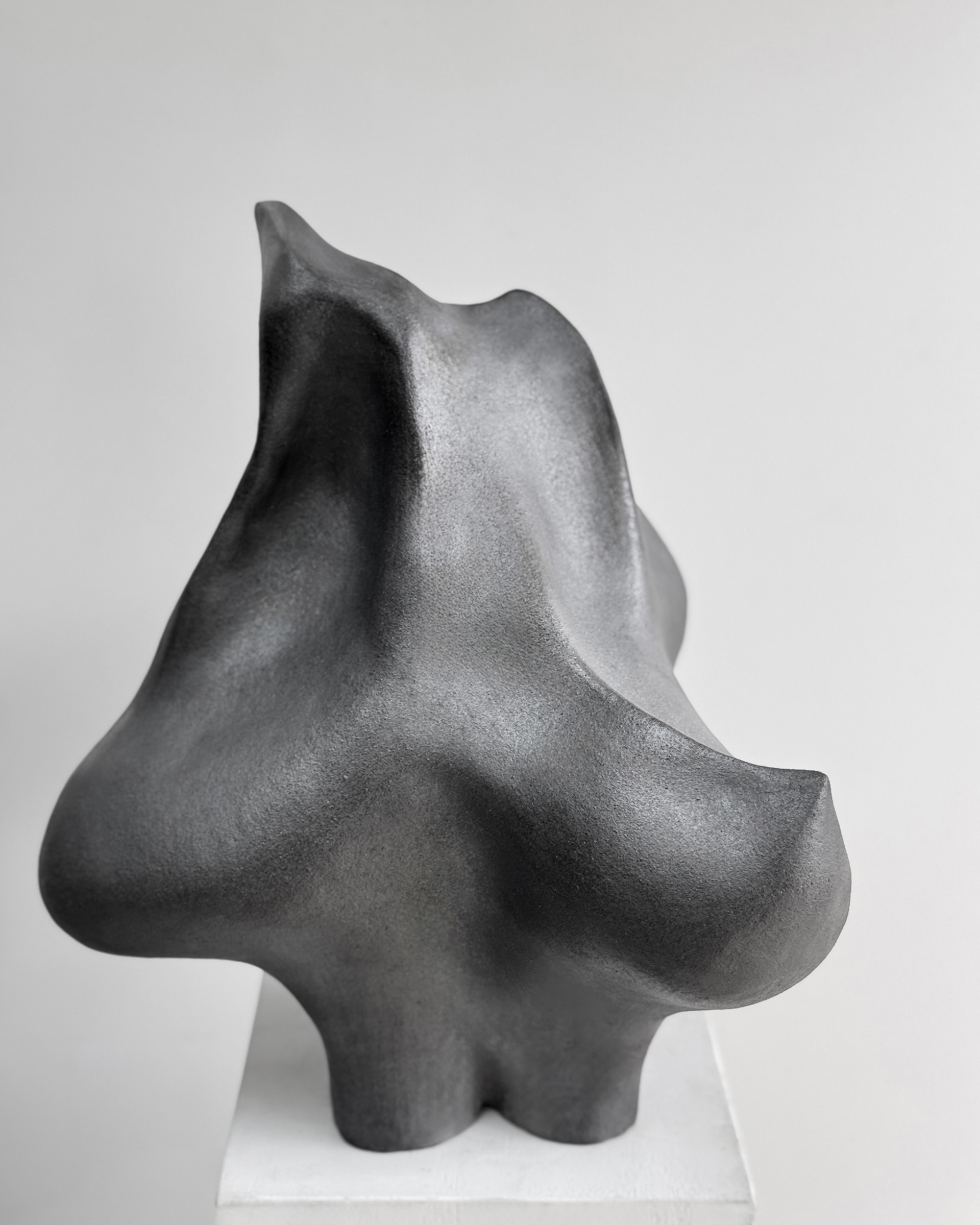 Spur, 2026. Gunmetal stoneware sculpture by Kendall Conrad, 6 × 17 × 12 in.