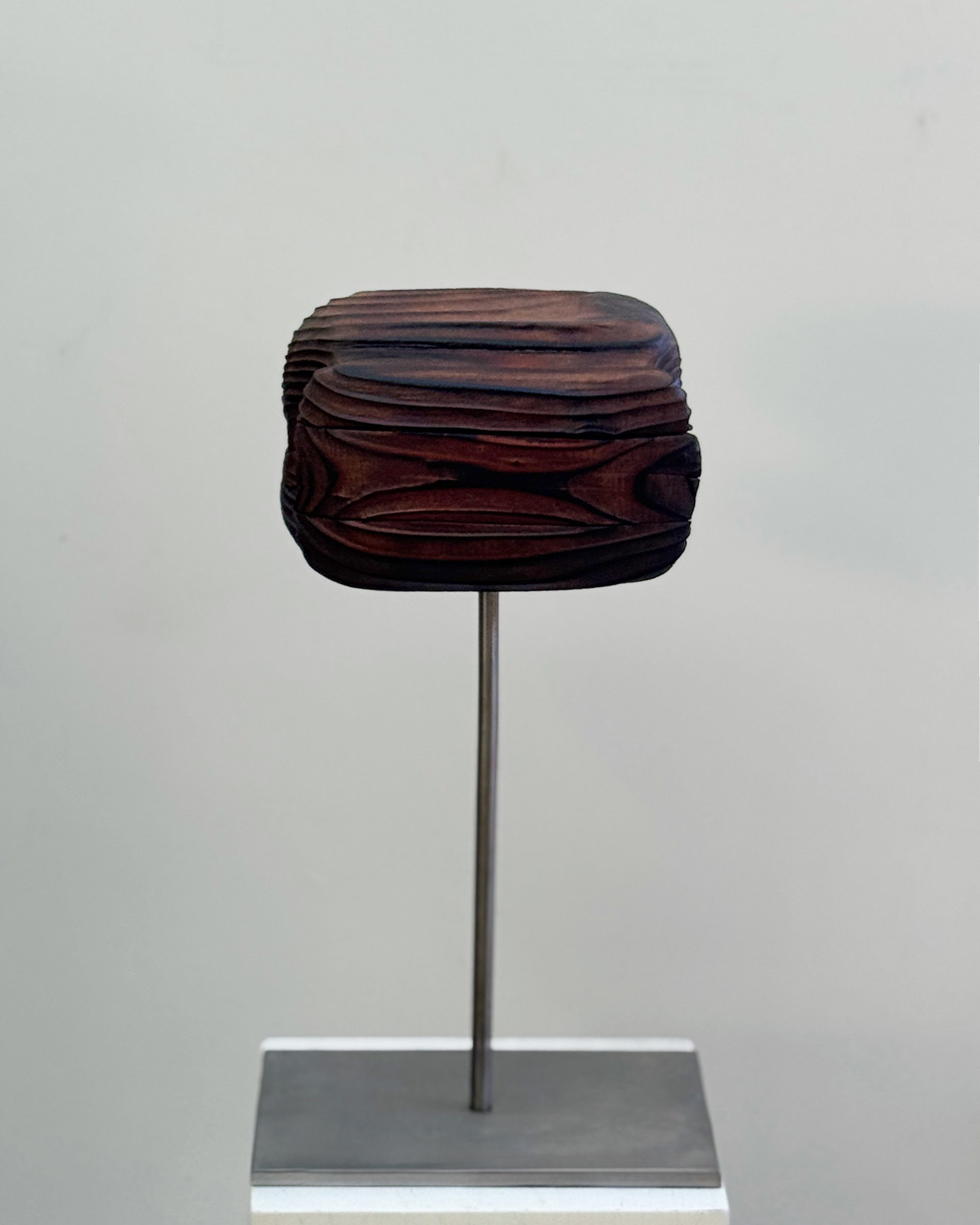 Folded Strata, 2025, charred, laminated redwood by Kendall Conrad — alternate view.