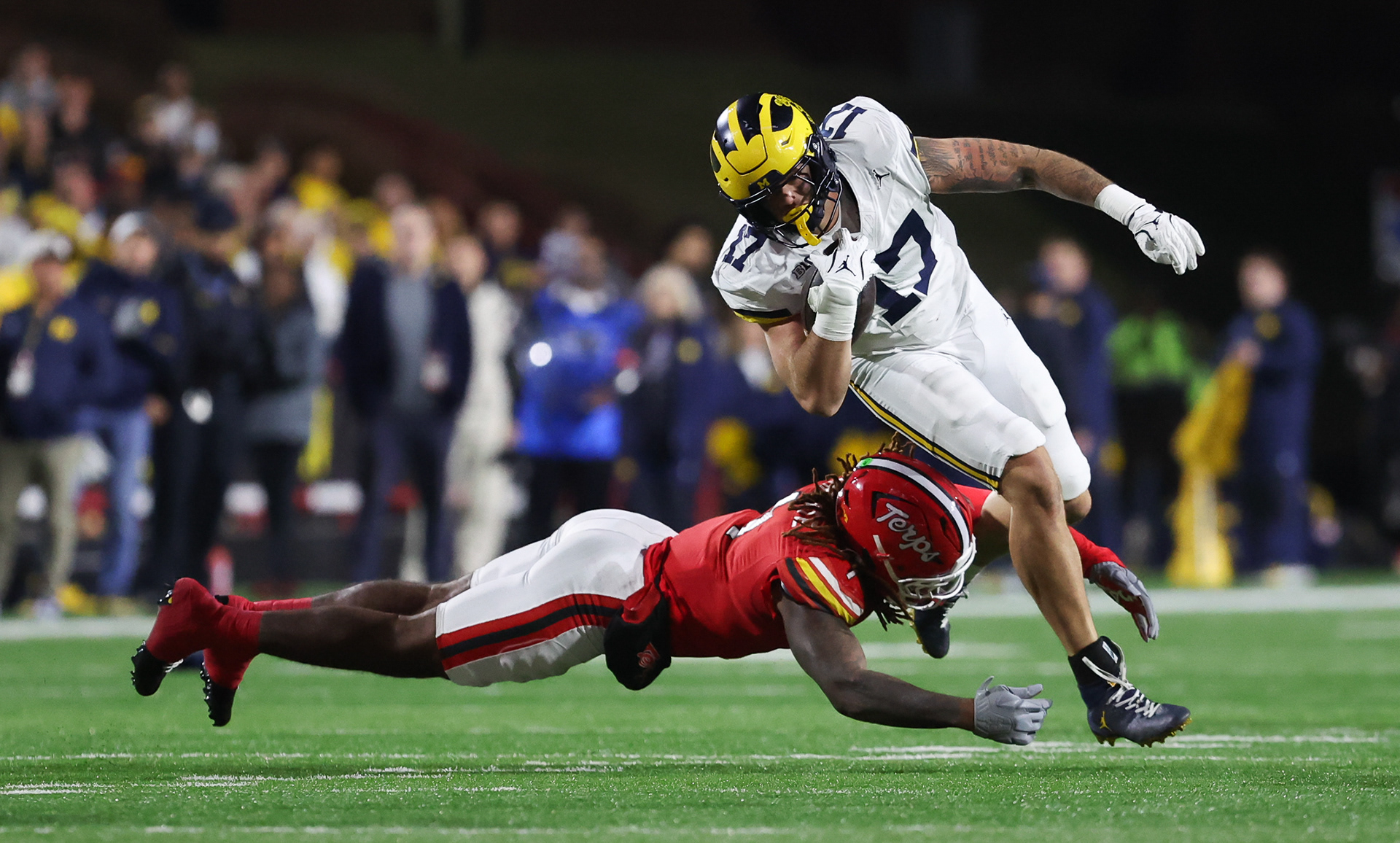 College Park, MD - University of Michigan Senior TE #17 Marlin Klein avoids a tackle against University of Marlyand defender during B1G Ten Rivilary Weekend 2025  