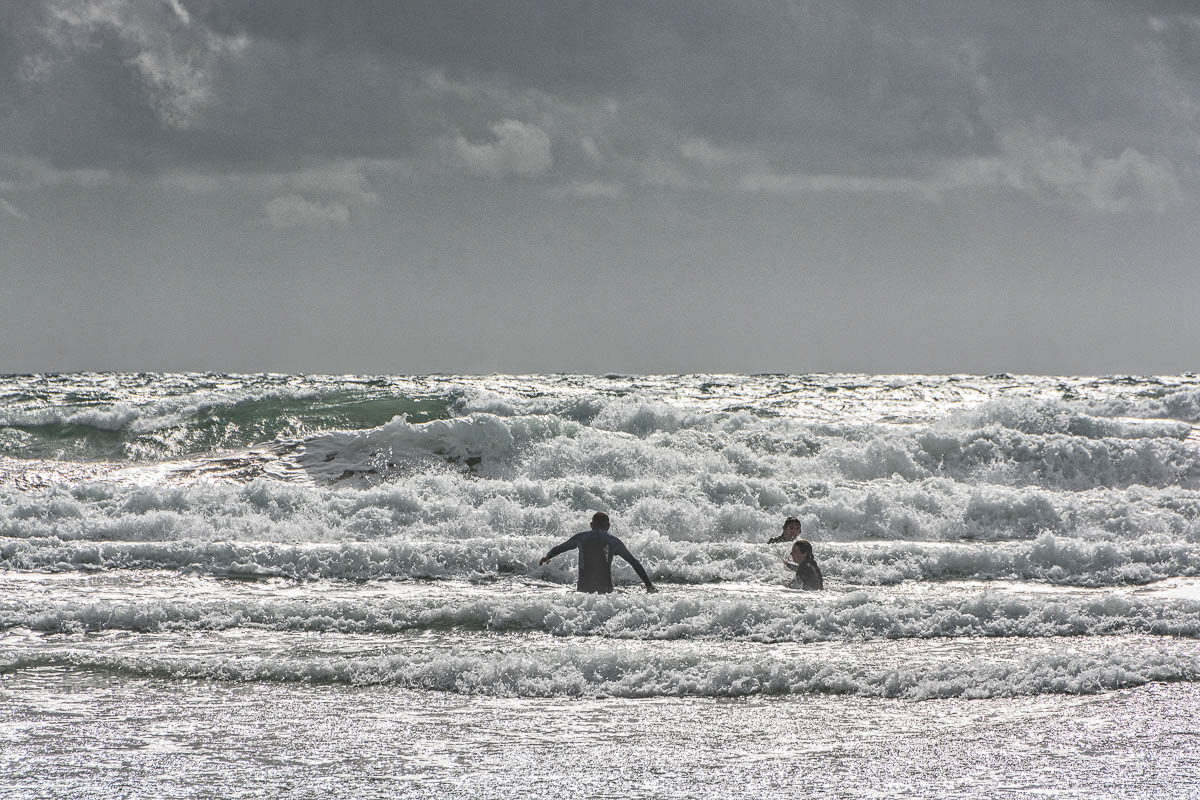 Enjoying the surf on Sandymouth Beach, Bude