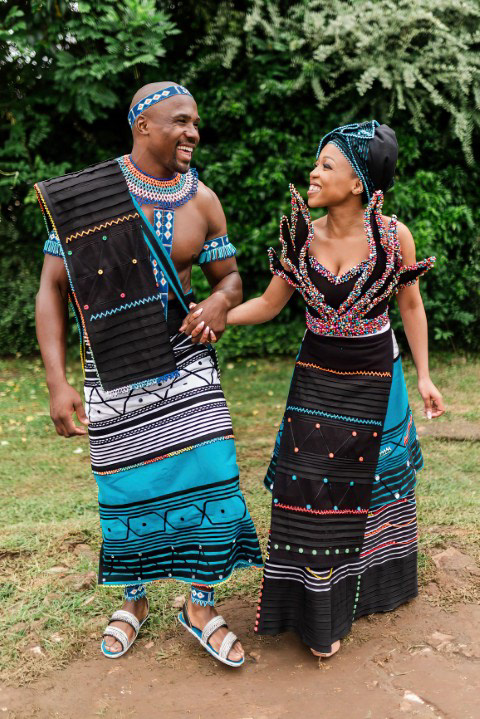 Former Blitzboks captain Siviwe Soyizwapi and wife Zenande in vibrant traditional Xhosa attire during their Maclear wedding.