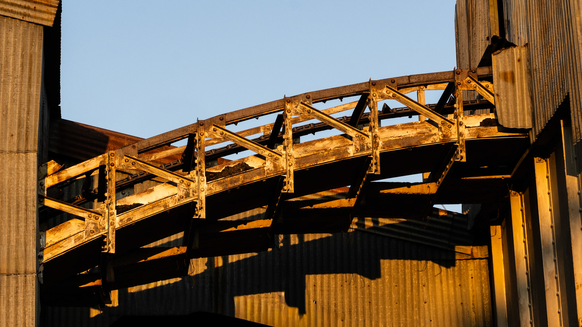 My brother-in-law took me for a tour of some interesting sites north of Rock Springs, Wyoming today. One stop was the Reliance Tipple coal mine. This conveyor assembly was pretty interesting bathed in the sunrise light.