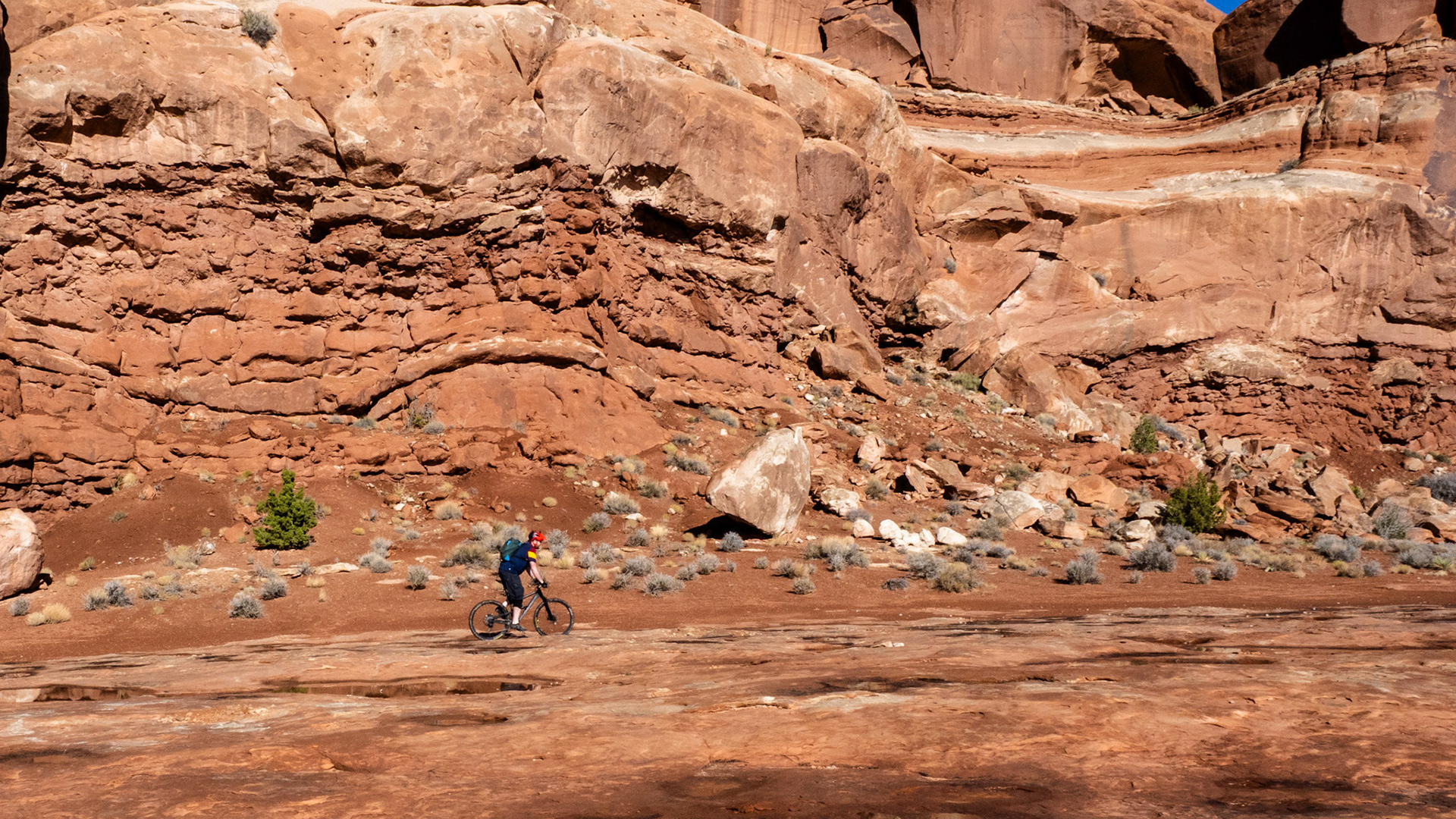 My first encounter with the Moab Red Rock Country was 45 years ago. We were traveling back from back from a X-C ski race in Park City to the UNM in Albuquerque and drove by the red cliffs in Moab and fell in love with it. My son riding against the red cliffs on the M&amp;M trail.