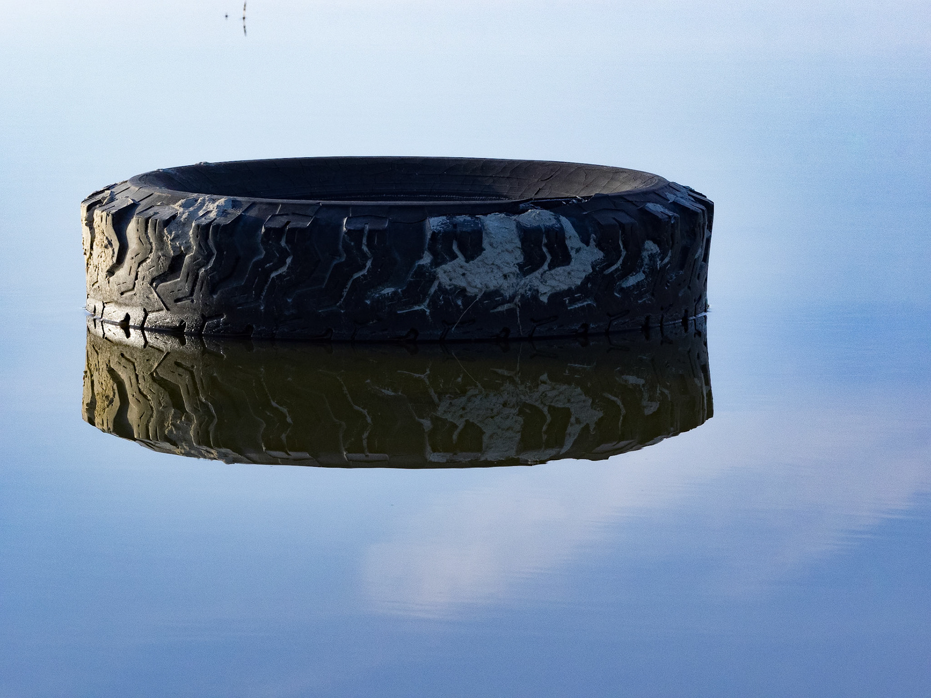Unfortunatly, the low water levels of the Great Salt Lake reveal items we have left behind. Exploring my love of negative space and reflections make this tire appear as if it is floating in mid air.