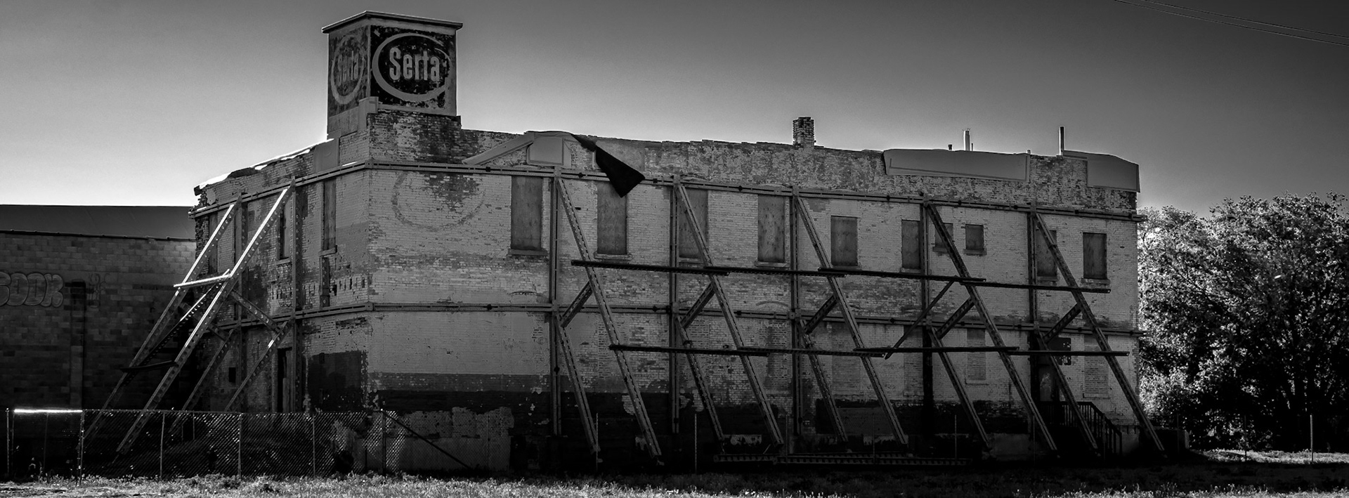 This old Serta building needs a belt and suspenders to keep standing.