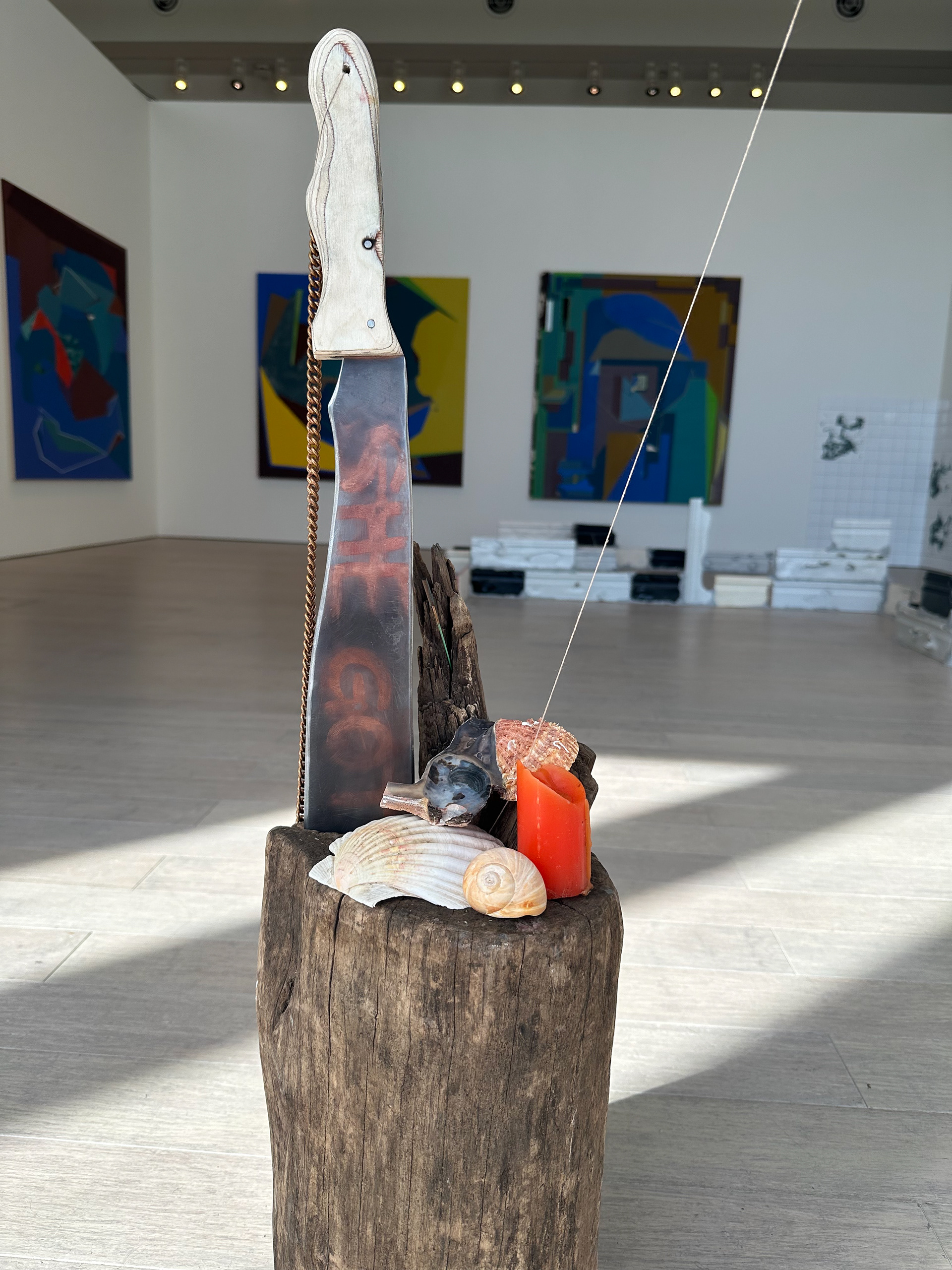 Below Sea Level Alter. Machete, Shells, Tree Trunk, Candle, Copper Chain. 2024.