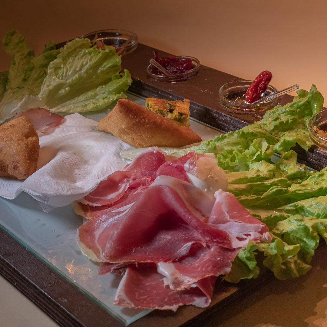 Cutting board with Fried Dumplings and Ham