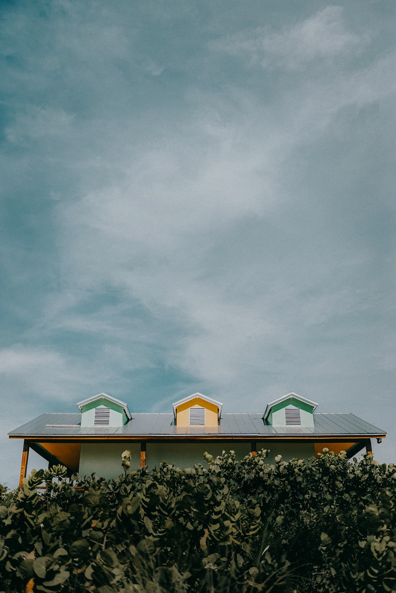Picturesque bungalows at Half Moon Cay, Little San Salvador Island, The Bahamas.