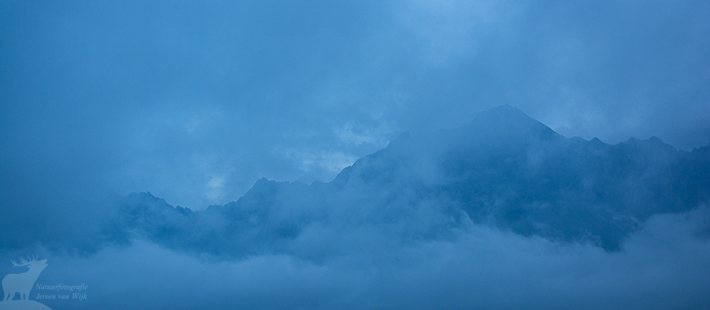 Mountain peaks of the Greater Caucasus covered in clouds