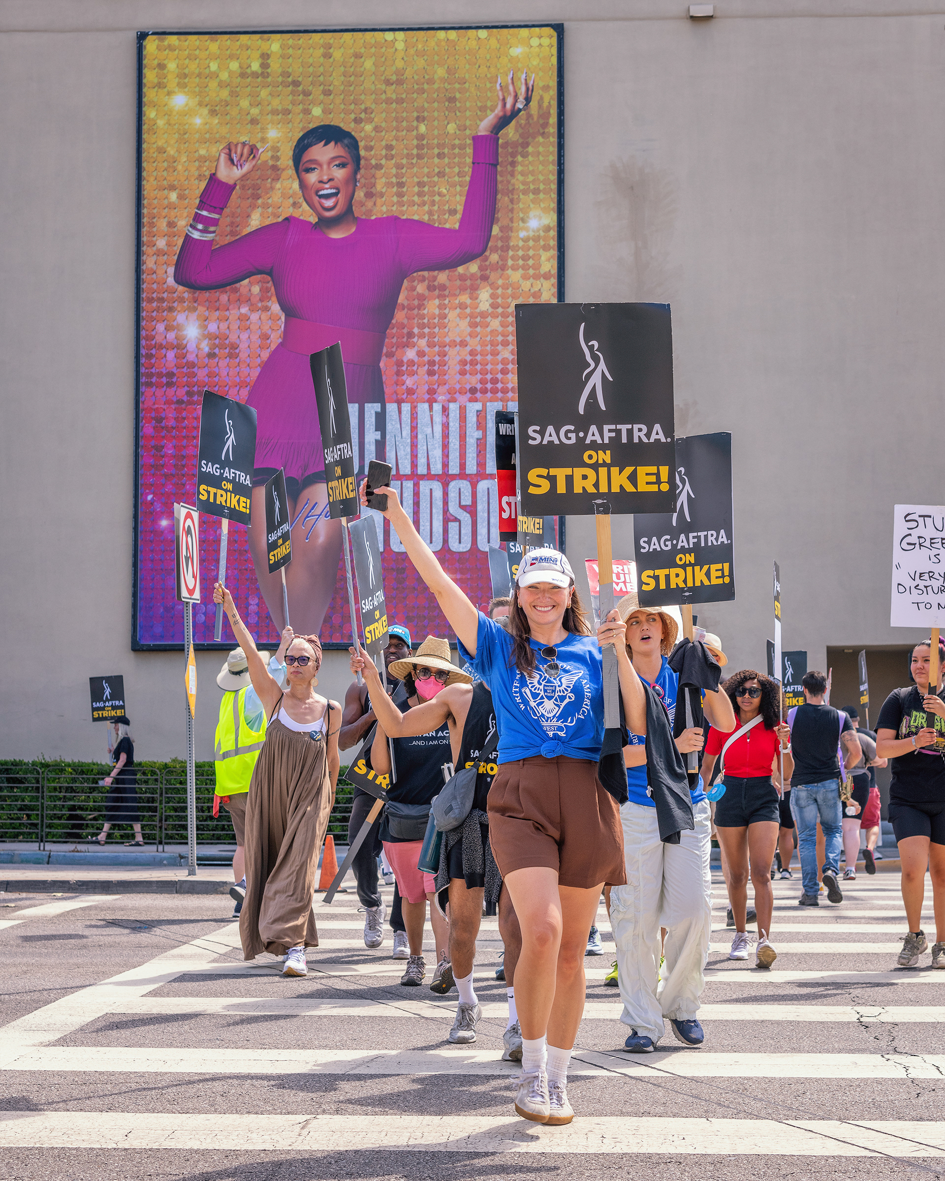 Burbank, CA, USA – July 26, 2023: Members of the Writers Guild of America, SAG and AFTRA unions strike outside Warner Brothers studio in Burbank, CA.