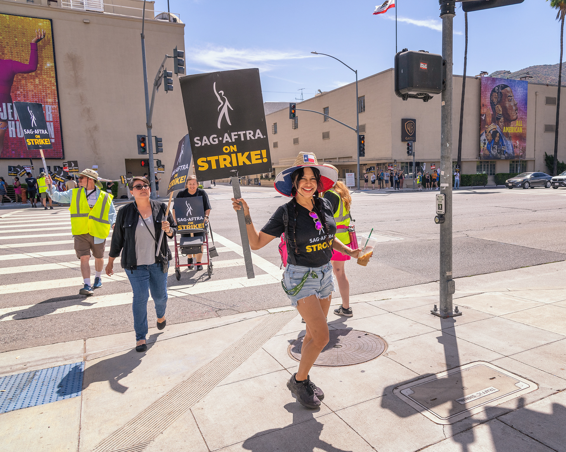 Burbank, CA, USA – July 26, 2023: Members of the Writers Guild of America, SAG and AFTRA unions strike outside Warner Brothers studio in Burbank, CA.