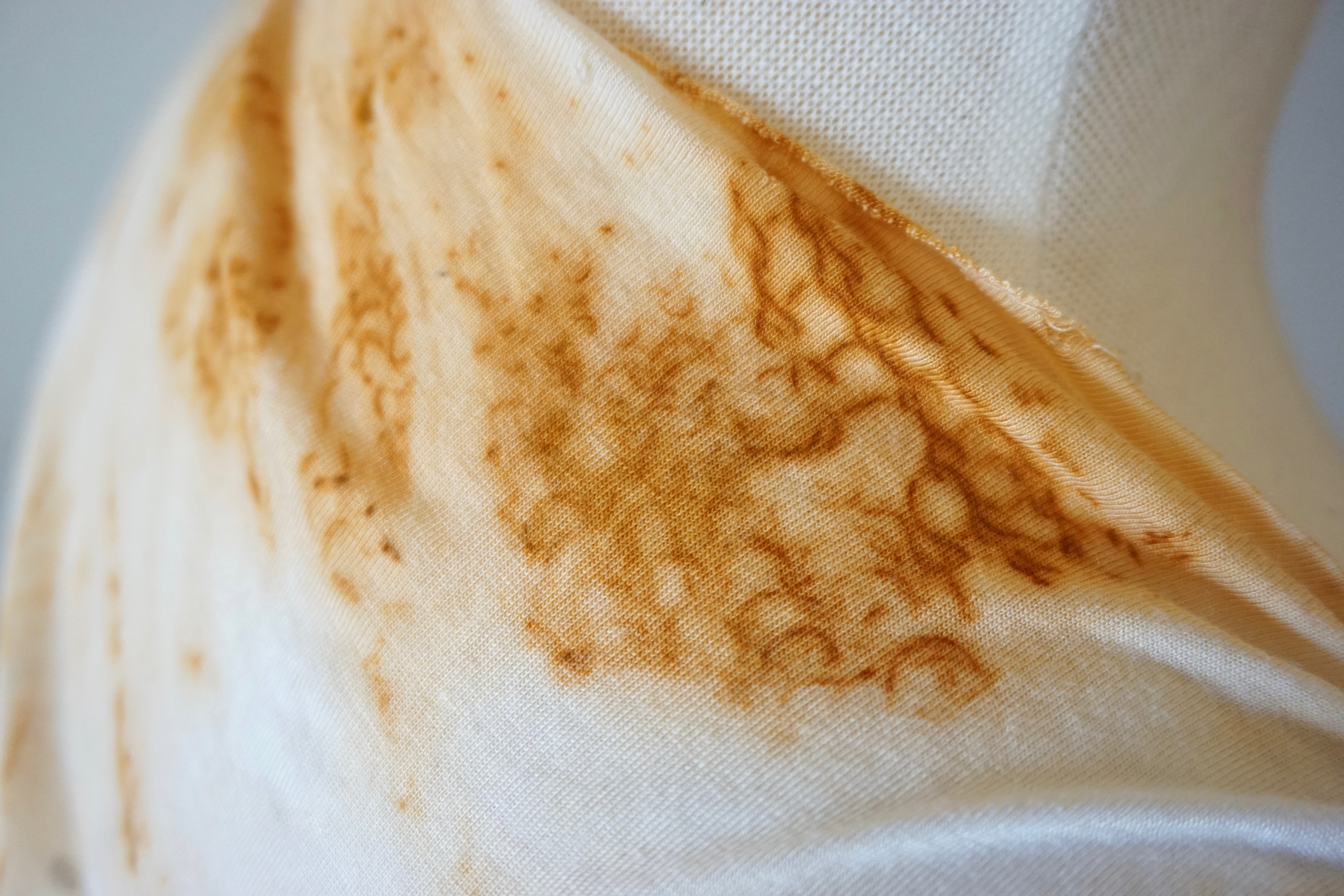 A close-up on rust-dyed dress for Titania in the Punktale, AK original, 2018