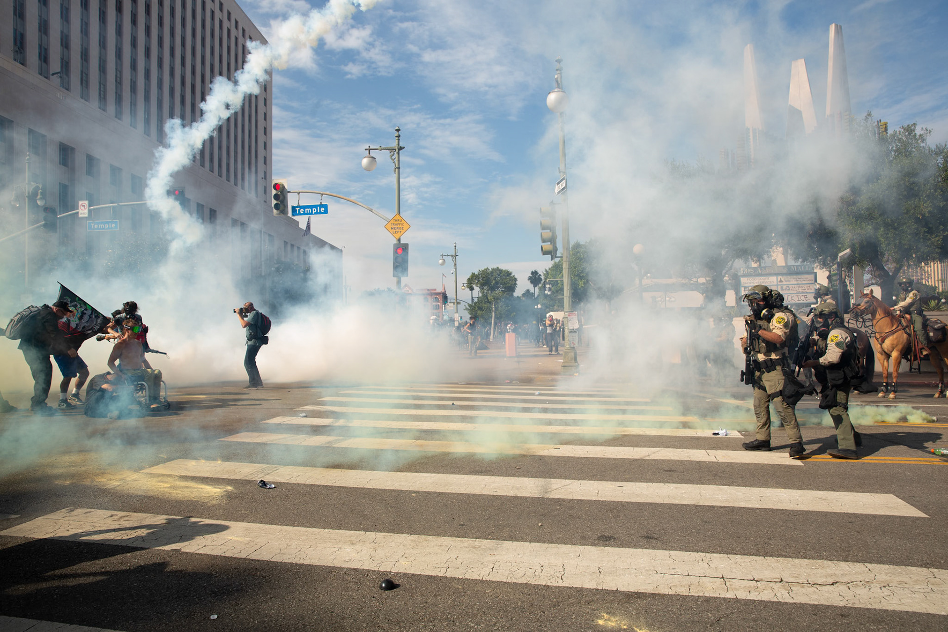 Los Angeles County Shriffs fires tear gas and flash bang grenades at peaceful demonstrators during a march against the Trump Military Parade and immigration raids by ICE in Downtown Los Angeles on June 13, 2025